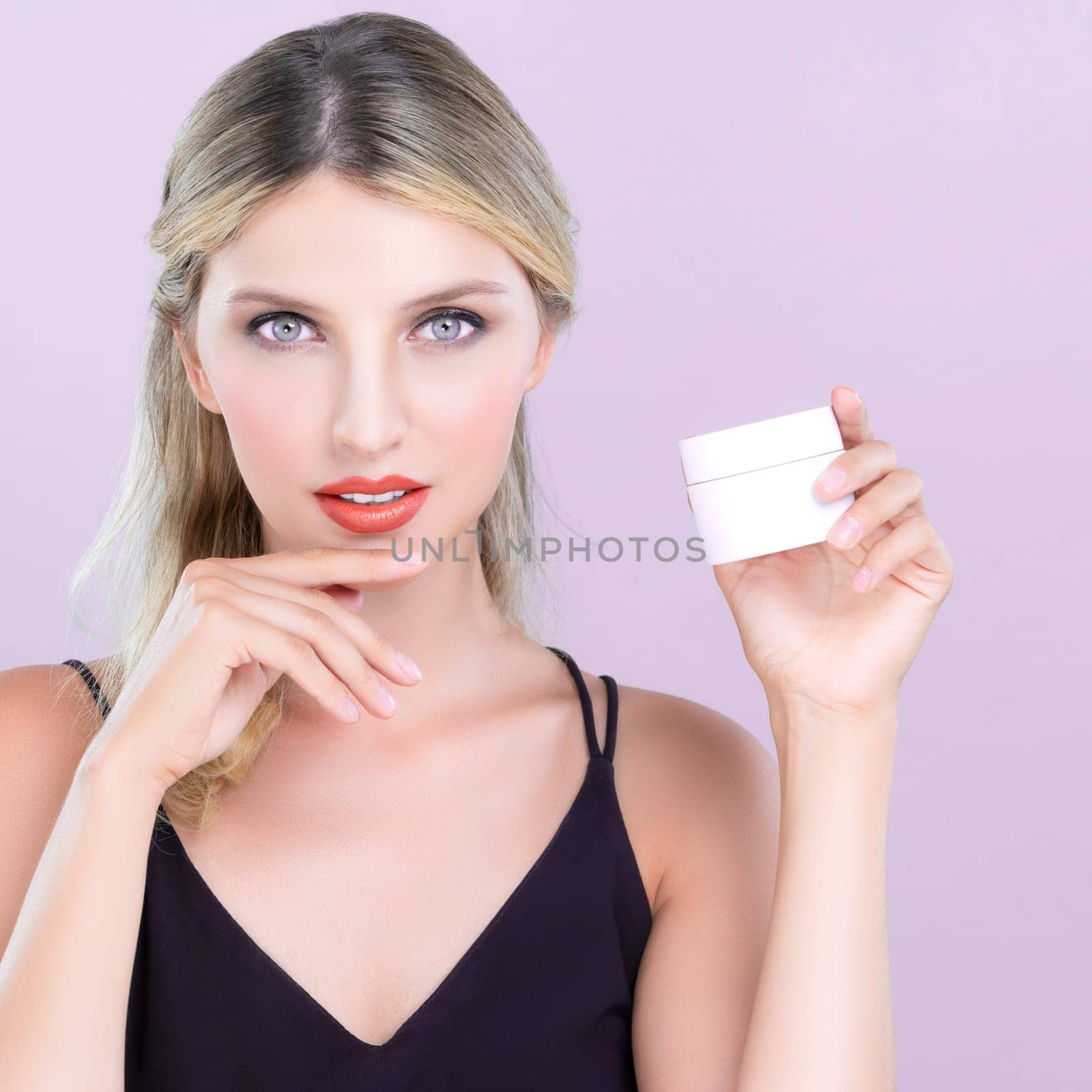Alluring beautiful perfect cosmetic skin woman portrait hold mockup jar cream or moisturizer for skincare treatment, anti-aging product in pink isolated background. Natural healthy skin model concept.