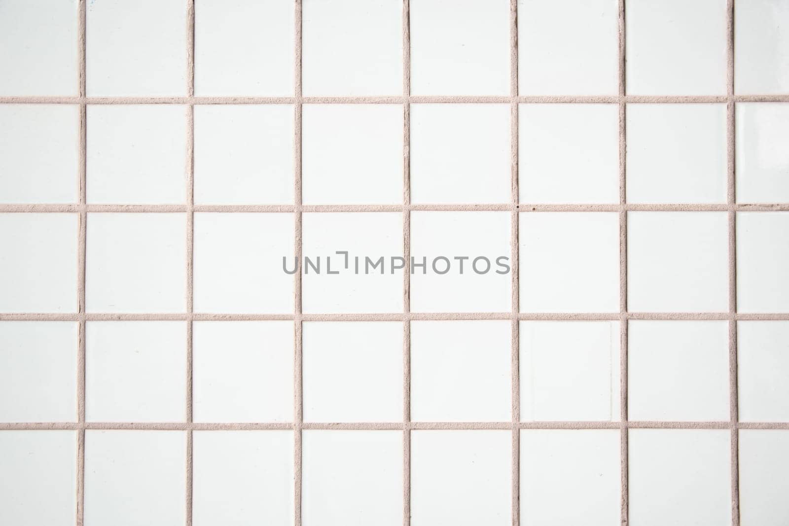 white tile wall, abstract pattern mosaic background, textured wall or floor in bathroom, Space For Text. High quality photo