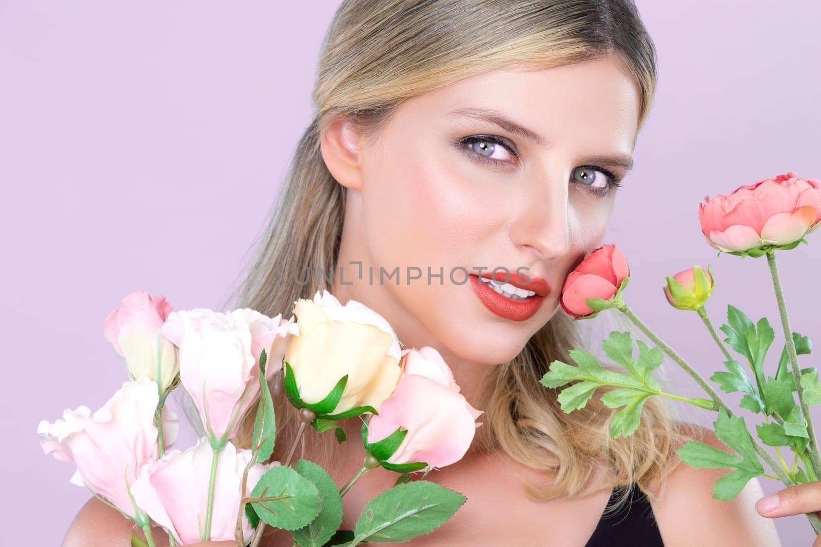 Closeup young woman with alluring flawless makeup with flower. by biancoblue