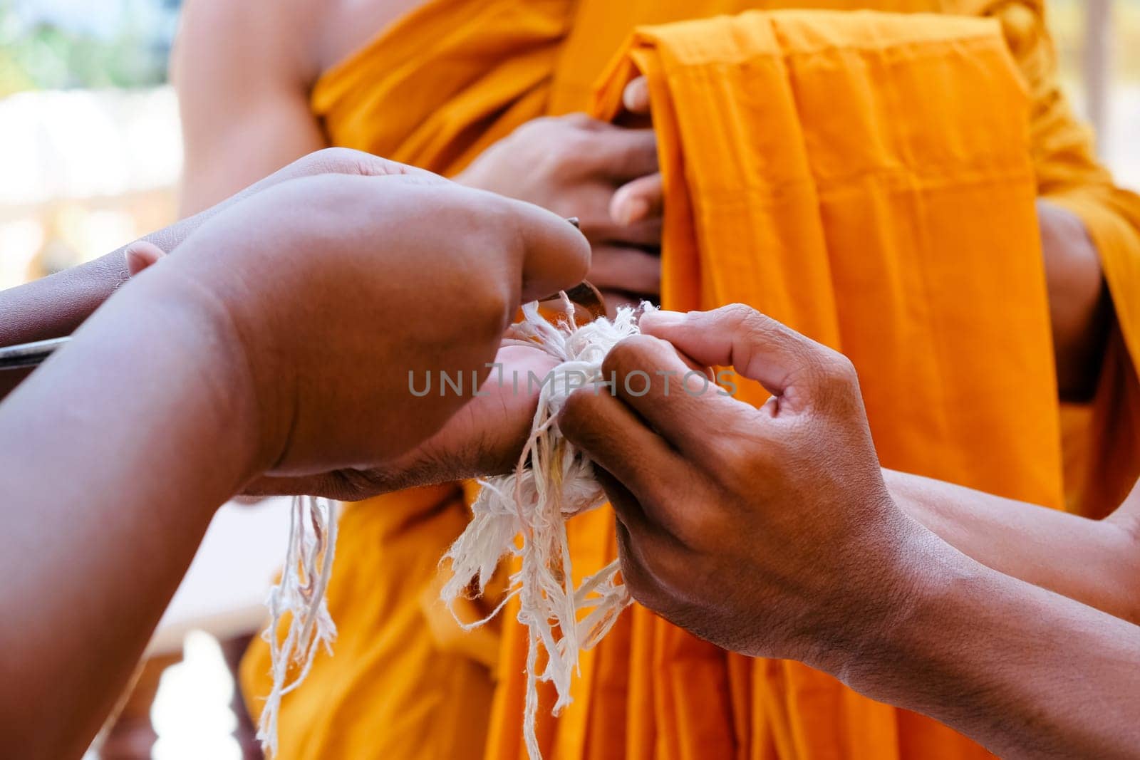 Image of ordination ceremony in buddhism, ceremonial thread