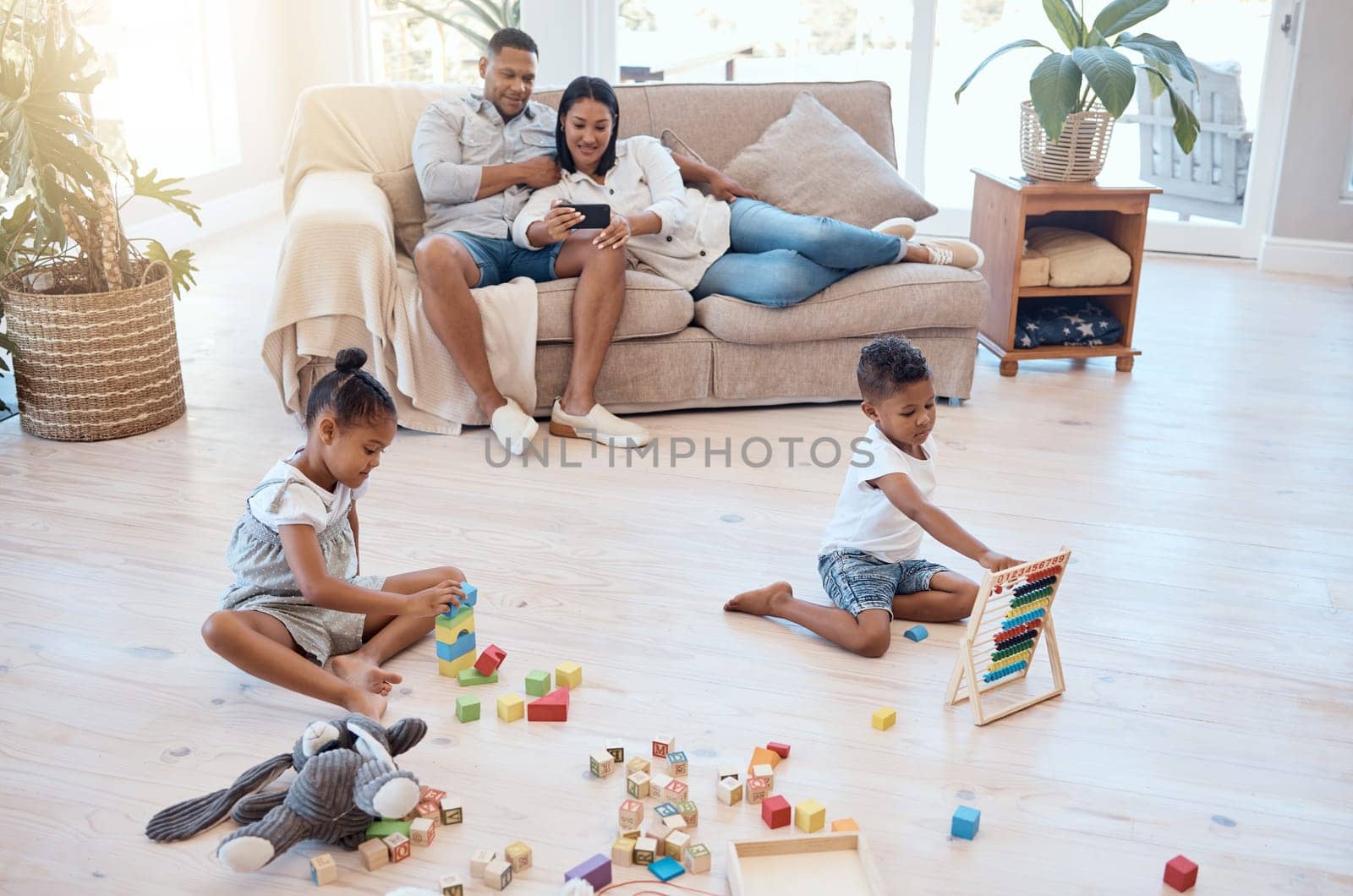 Mother, father or children in house living room or Brazilian family home with phone movie streaming, toy building blocks and abacus math set. Man, woman or kids in relax game and education technology.