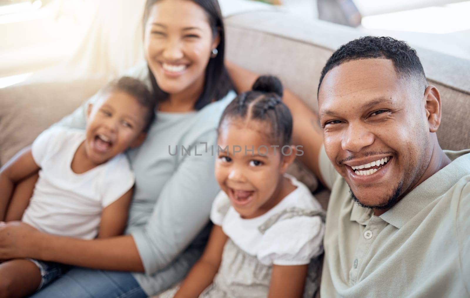 Happy, relax and selfie with family on sofa for smile, support or social media app together. Technology, photographer and portrait of parents with children in living room at home for bonding and care.