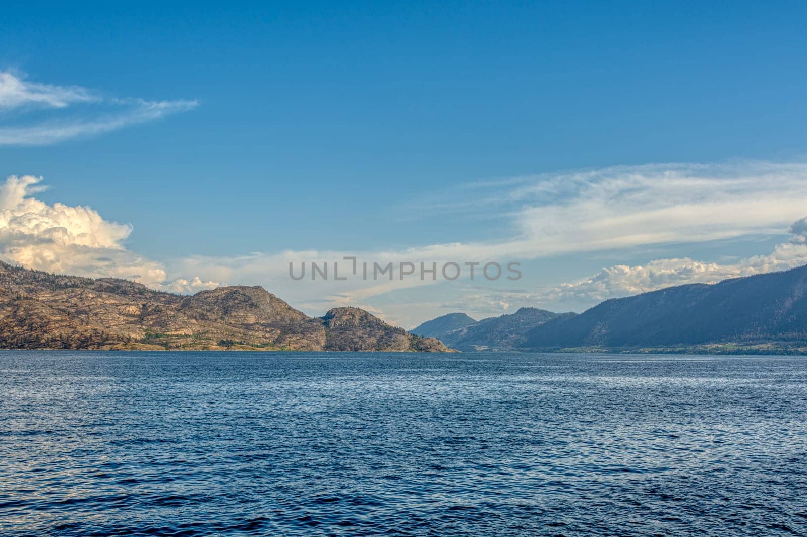 Scenery view of rocky slope over the lake in British Columbia.