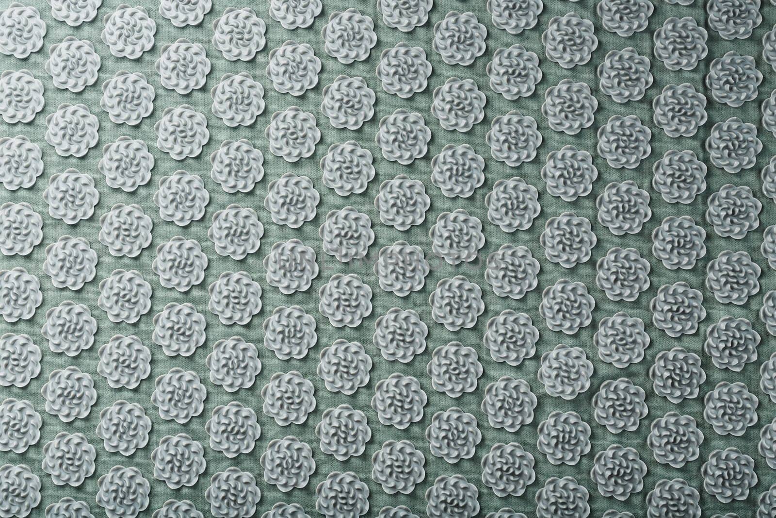 Massage mat with prickly spikes Kuznetsov applicator top view. On a gray background with free space