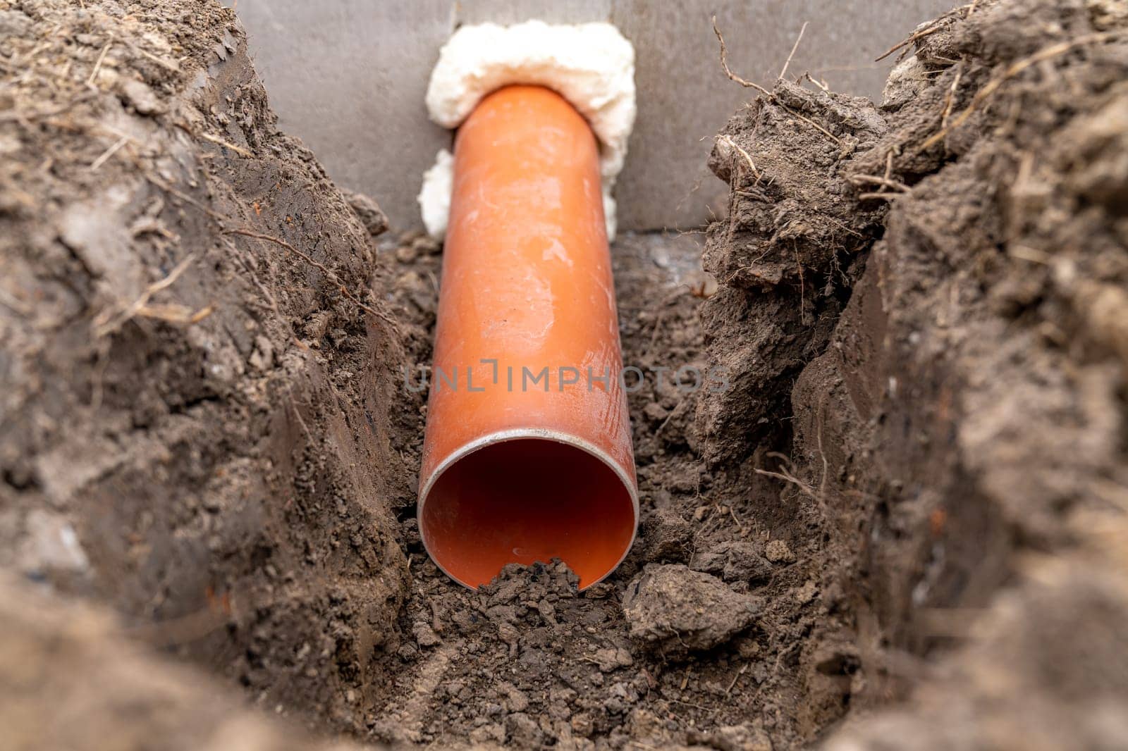 plastic pipe for sewage network in the base plate at the construction site.