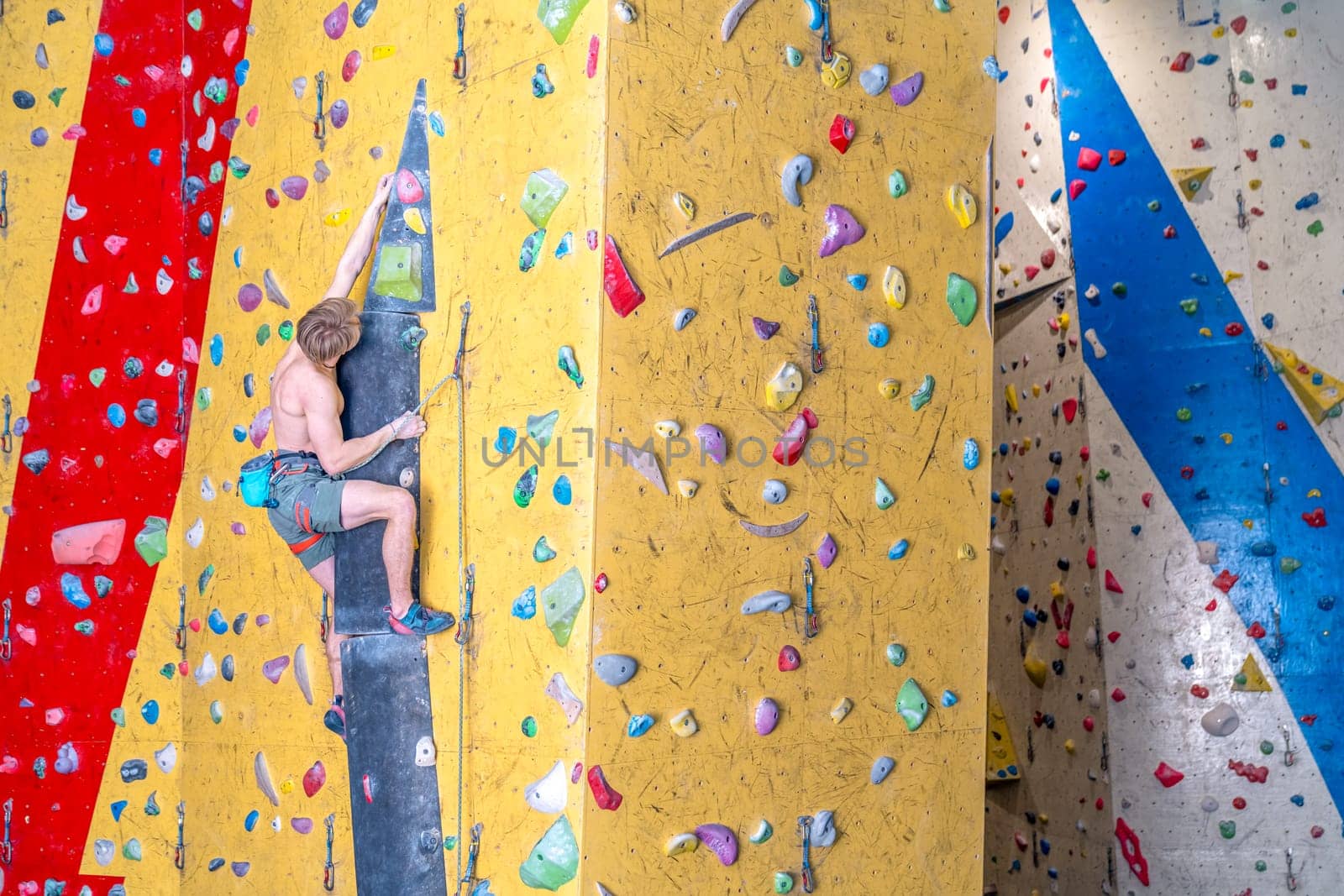 climbing artificial climbing walls with belay rope. High quality photo