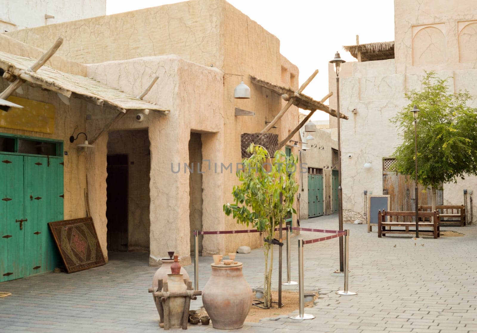 Narrow streets that create shade on a hot day in the old city of Dubai Creek and Bur district. Travel destinations and heritage village by Ekaterina34