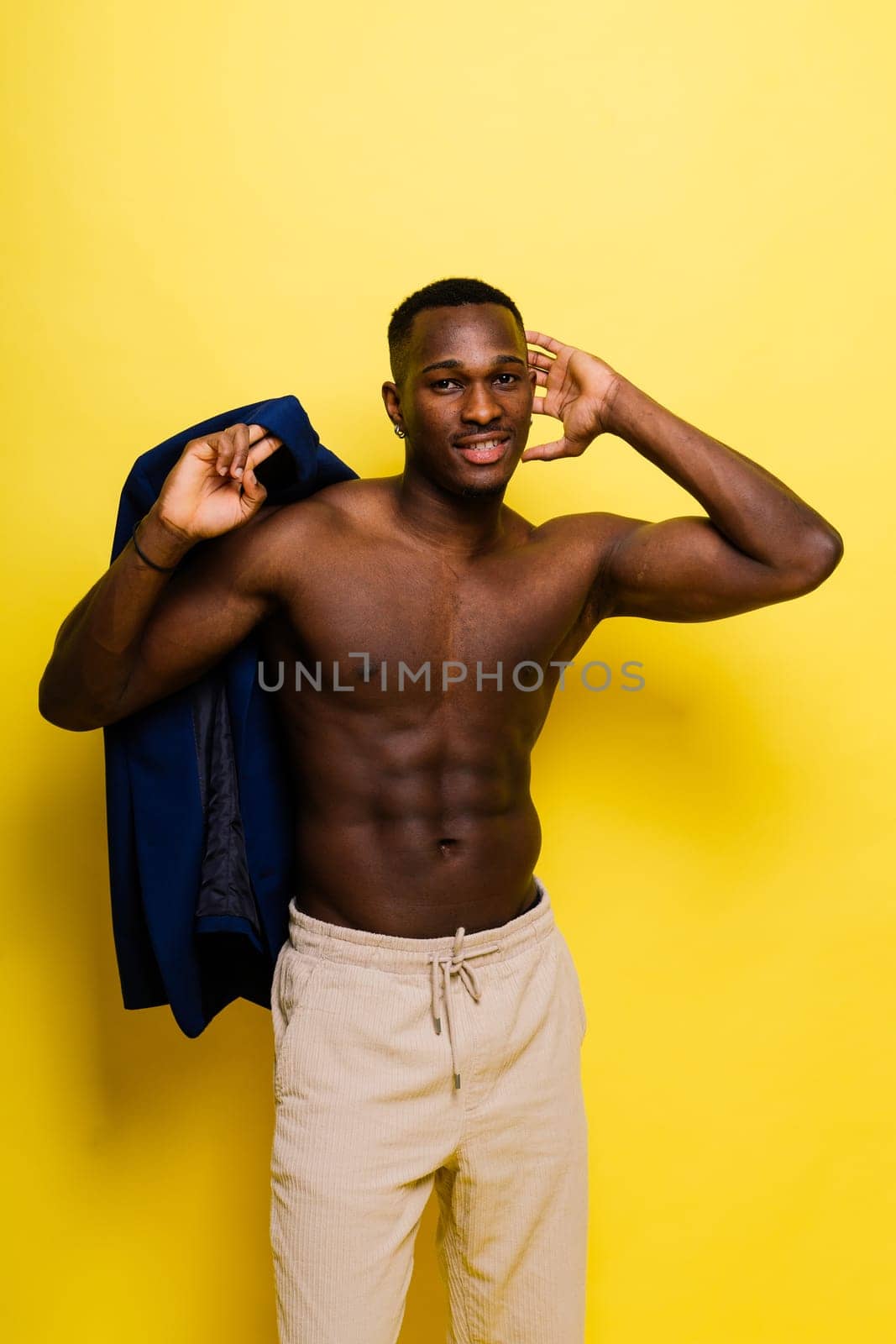 Young african man standing shirtless with a happy and cool smile on face. lucky person. by Zelenin
