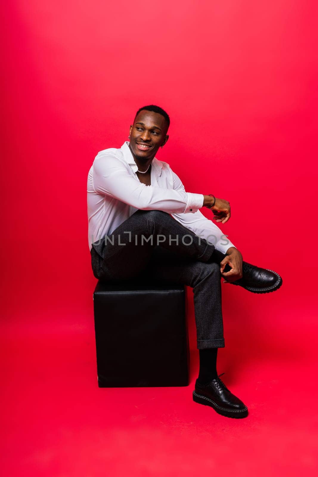 Young african man standing shirtless with a happy and cool smile on face. lucky person. by Zelenin