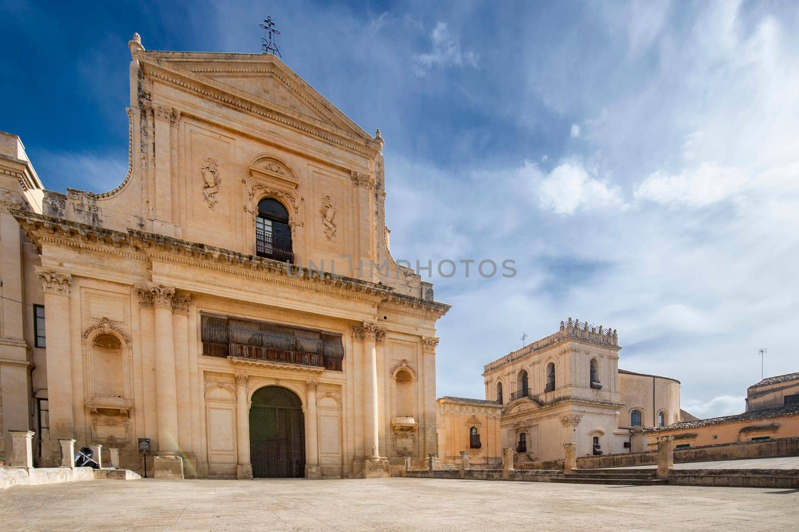 Scenic view in Noto, with San Salvatore Church and Santa Chiara Church—Province of Siracusa, Sicily, Italy.