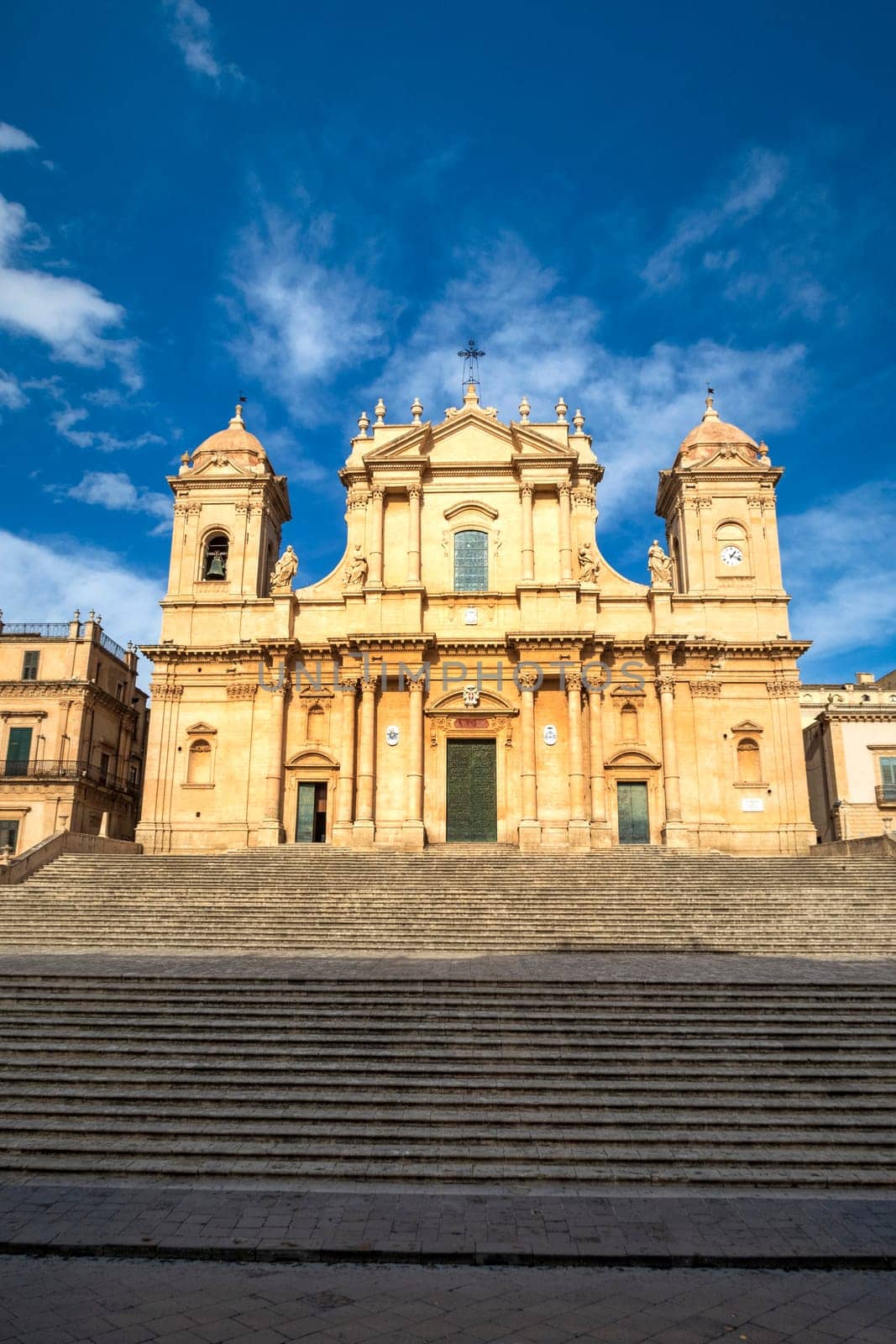 travel to Italy - front view of Noto Cathedral (Minor Basilica of St Nicholas of Myra) in Sicily. Vertical view by EdVal