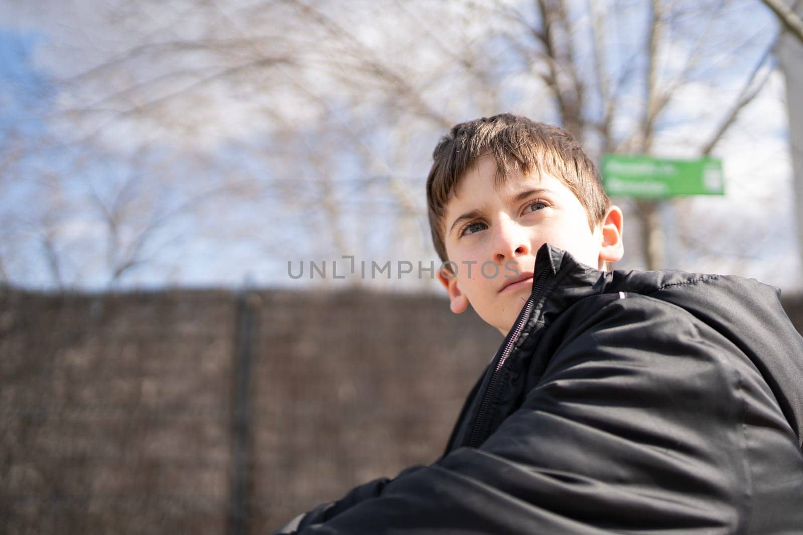 Portrait of handsome young boy relaxed and looking with confidence. copy space.