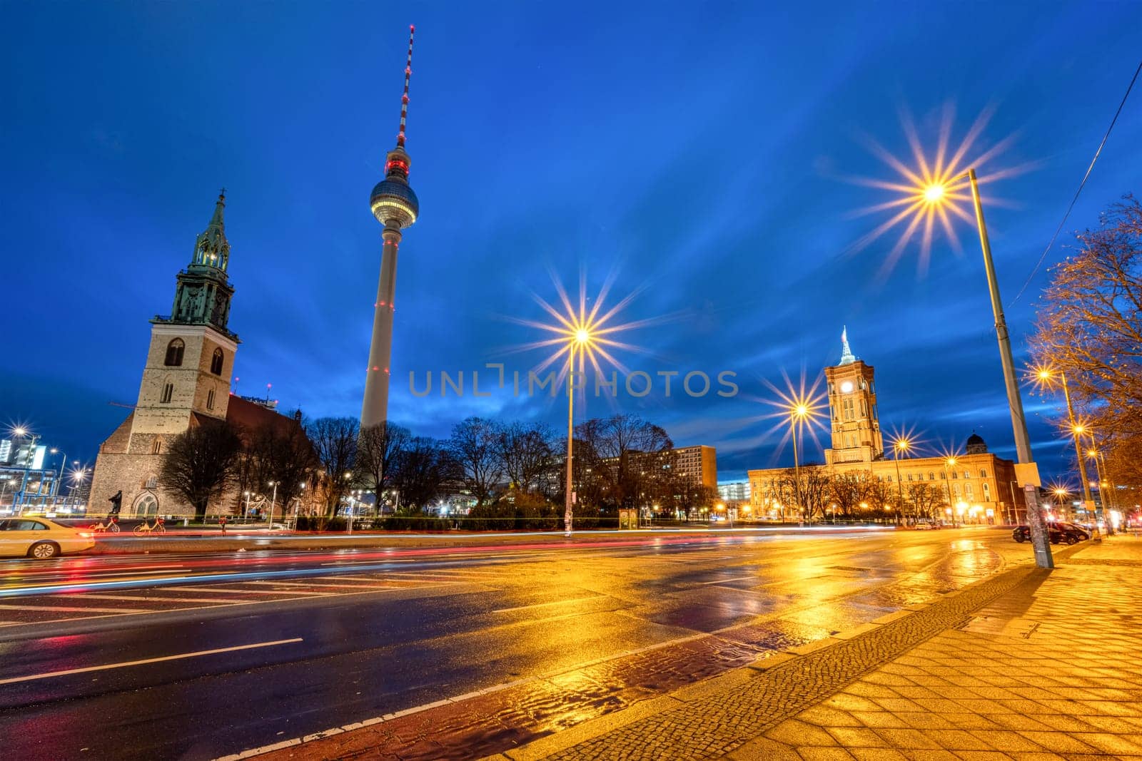 The famous TV Tower, the town hall and the St. Mary's Church at the Alexanderplatz in Berlin at night