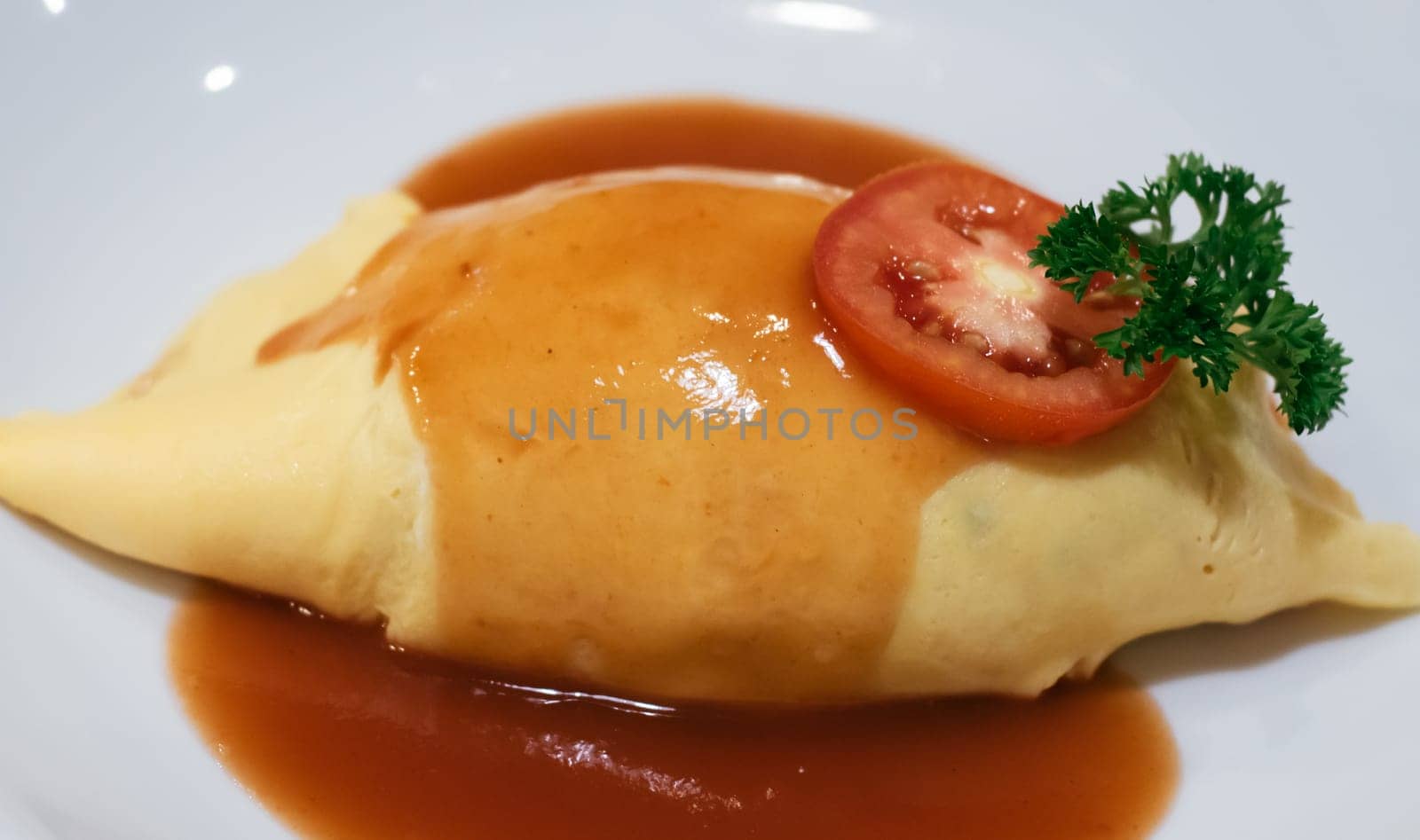 Omurice is a Japanese food that uses eggs to wrap rice.