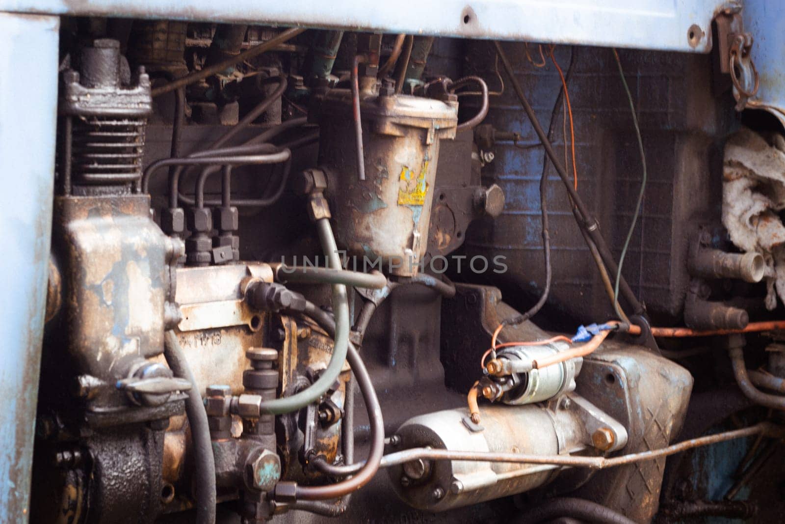 Close-up of the engine and tractor parts. Agricultural machinery. Harvesting. Mechanical engineering.