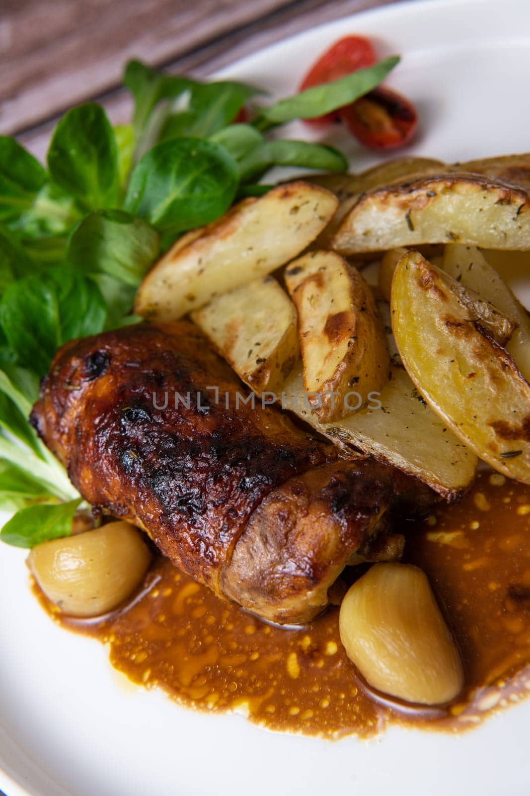 Recipe for boneless rolled chicken leg with potatoes and molasses-flavoured mache salad, High quality photo