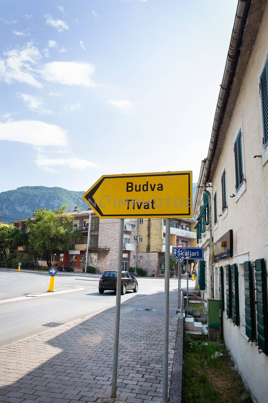 Photo of a road sign with the inscription of the cities of Budva and Tivat 05. 07. 2021 Kotor, Montenegro