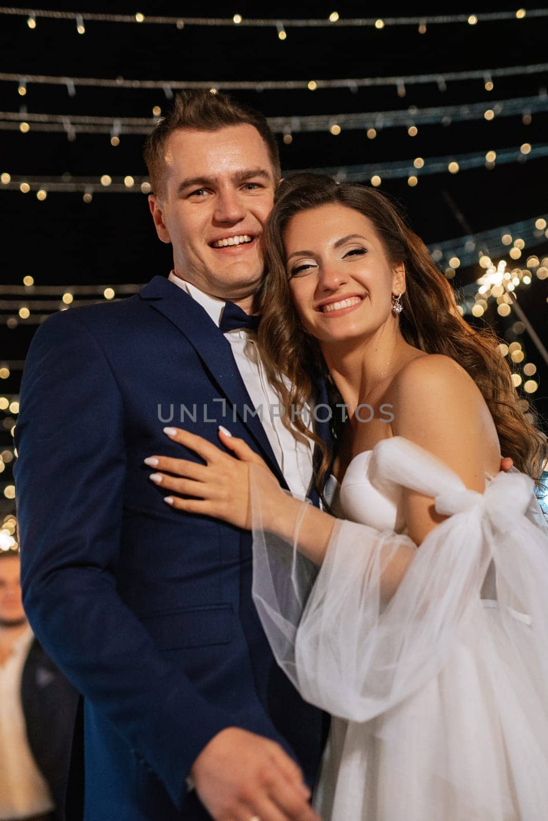 newlyweds at a wedding in the corridor of sparklers