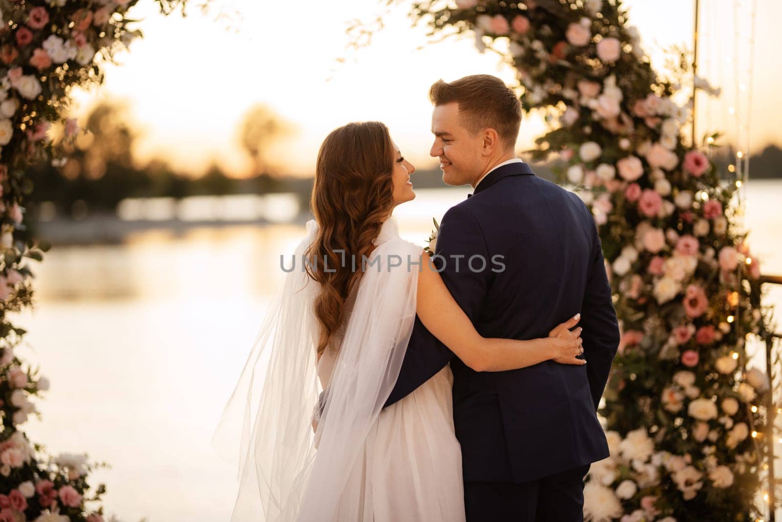 bride and groom against the backdrop of a yellow sunset by Andreua