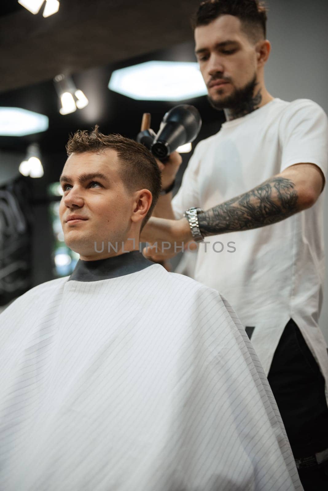 morning of the groom in the barber shop