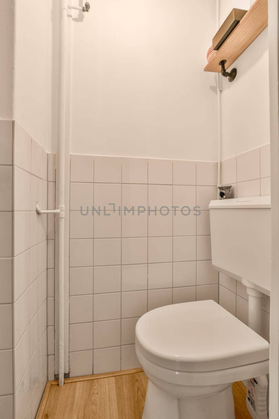 a small bathroom with a toilet and a shower by casamedia