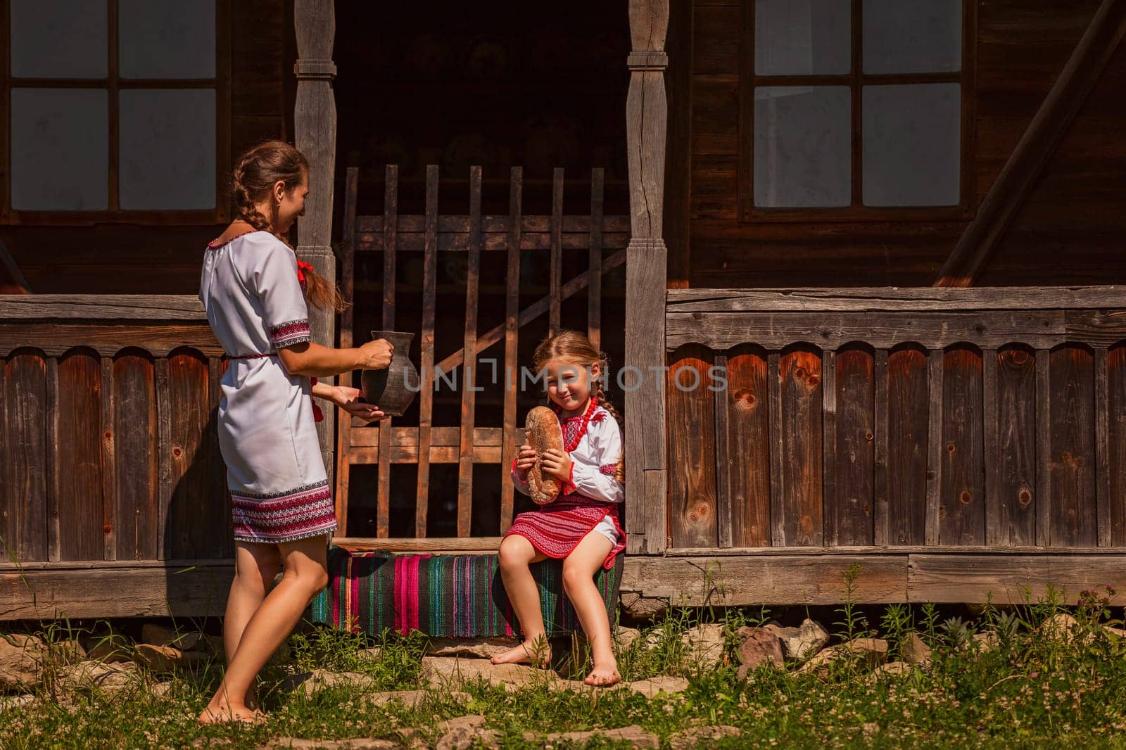 mother and daughter in Ukrainian folk dresses by zokov