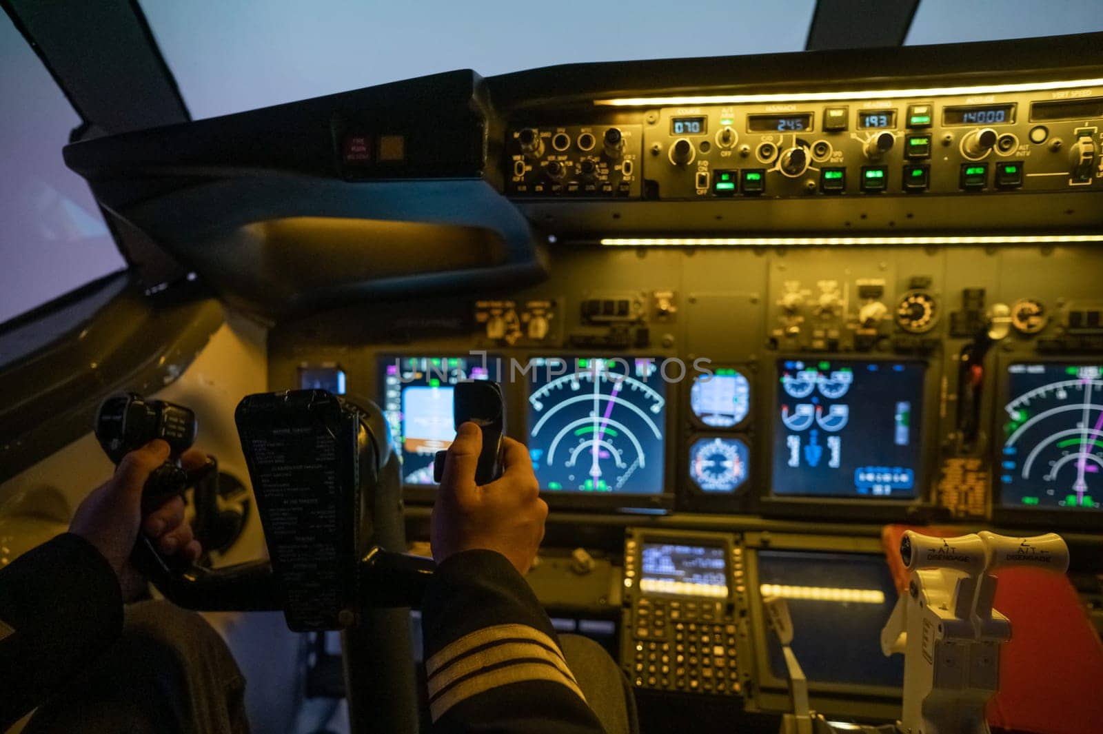 A man is studying to be a pilot in a flight simulator. Close-up of male hands navigating an aircraft