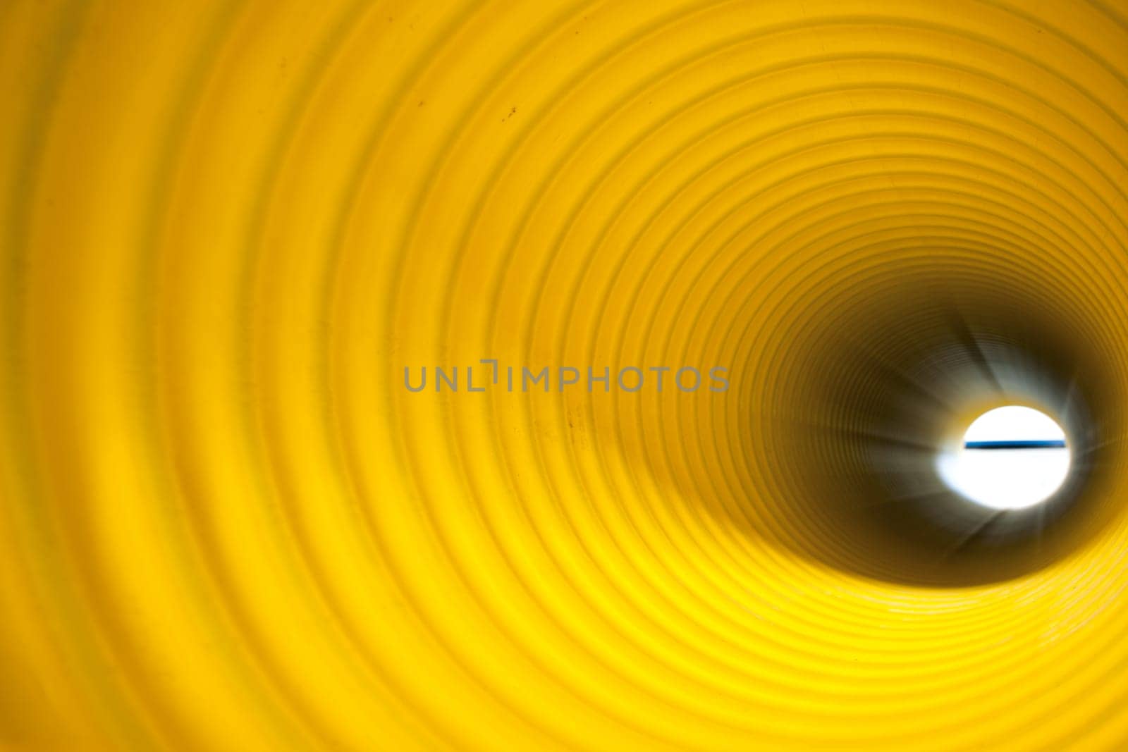 Bunches of PVC pipe sitting on palets at a wholesale pipe store.