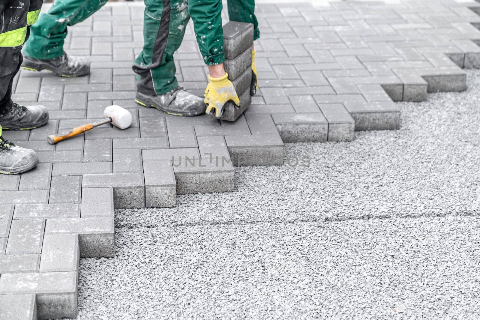 construction of a sidewalk from concrete blocks.