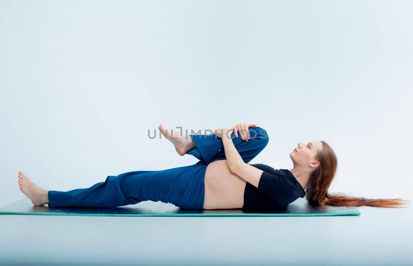 Stage of pregnancy. pregnant woman training yoga by kajasja