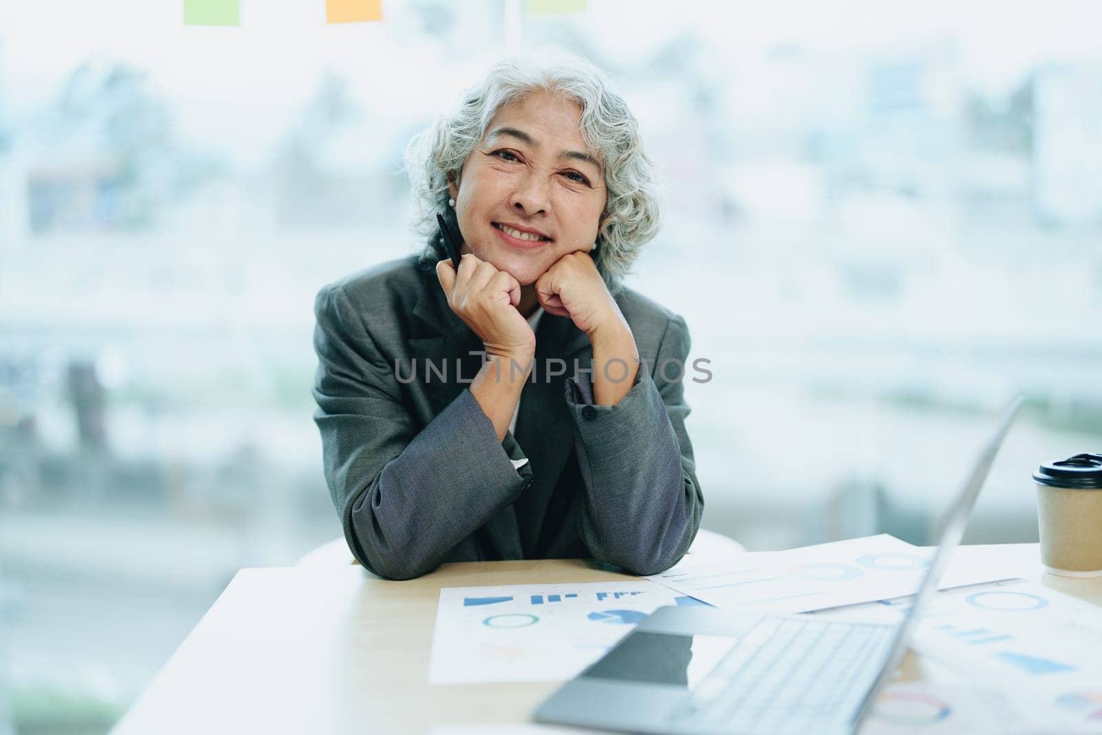 Portrait of a female business owner with a smiling face successfully invests his business in a conference room.