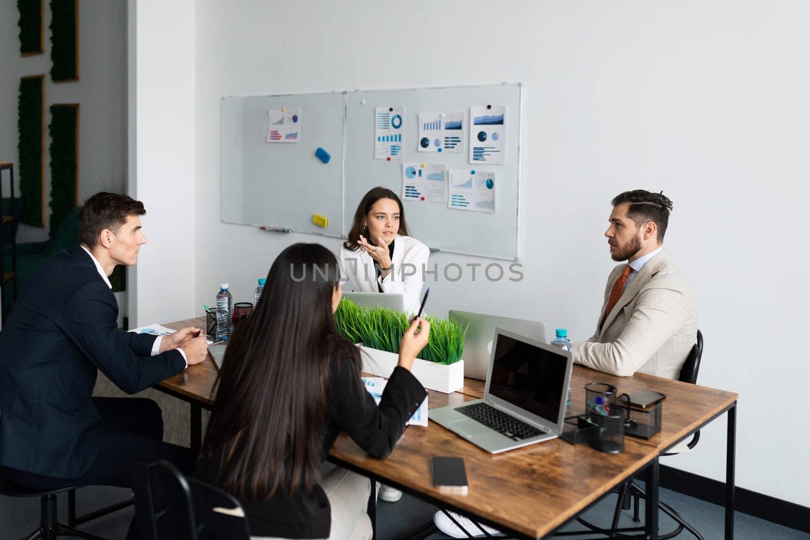 firm accountants discussing financial matters at a meeting.