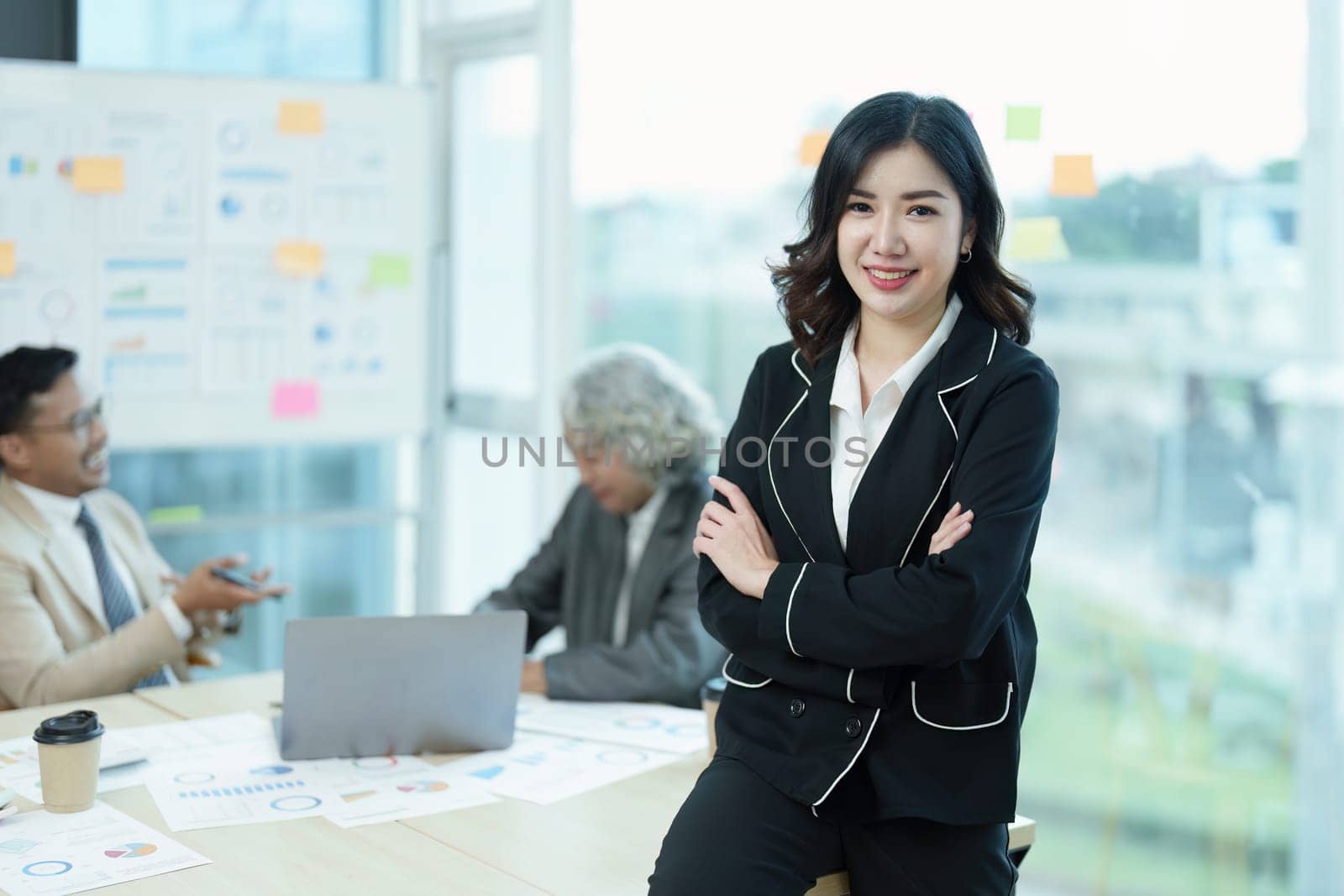 Portrait of a female business owner with a smiling face successfully invests his business in a conference room.