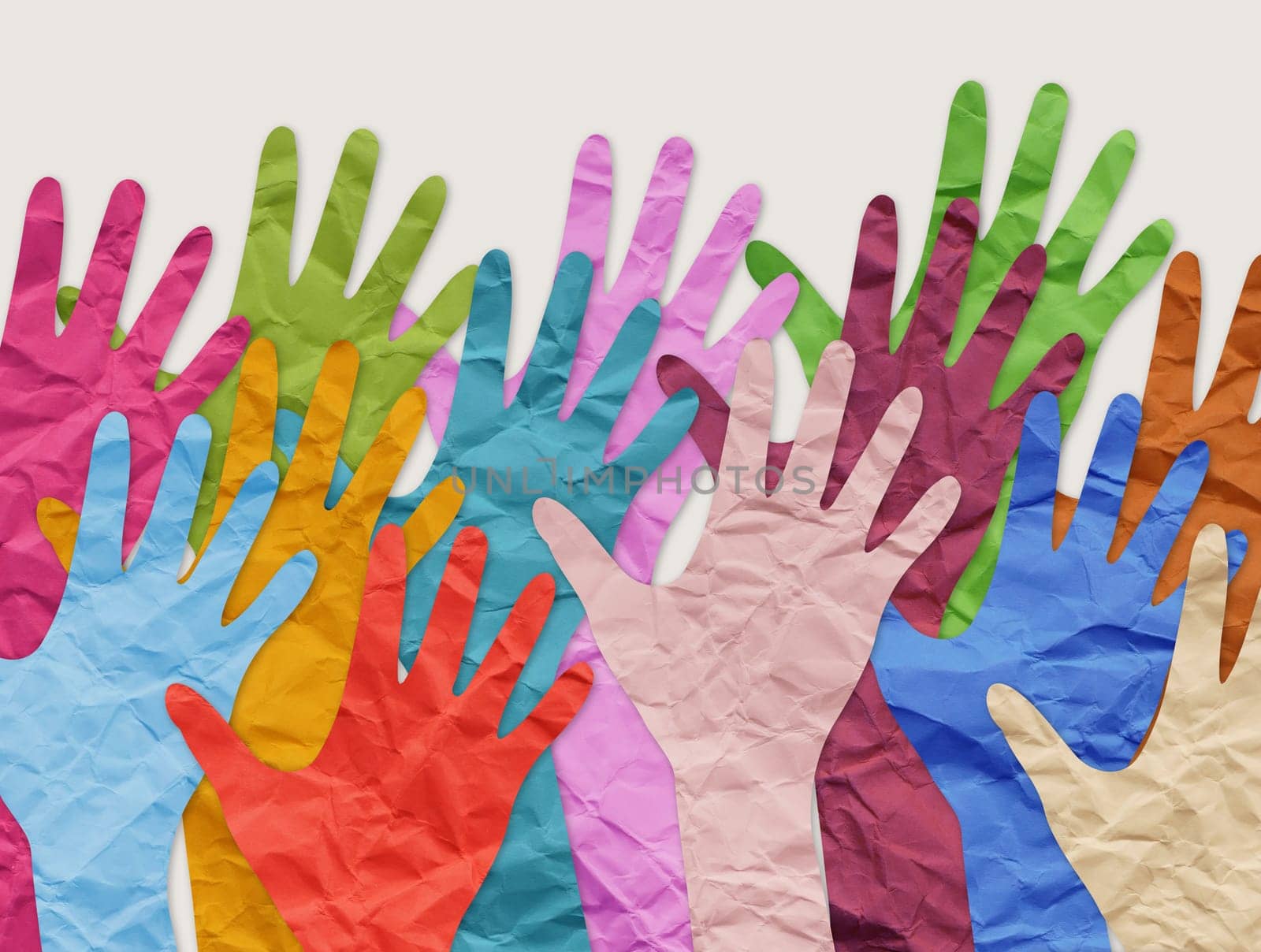 Collage of colorful paper hands as symbol of diversity and inclusion. by designer491