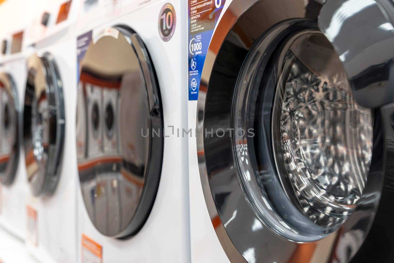 Sosnovy Bor, RUSSIA - JANUARY 12, 2023: household appliances in DNS store, washing machines. High quality photo