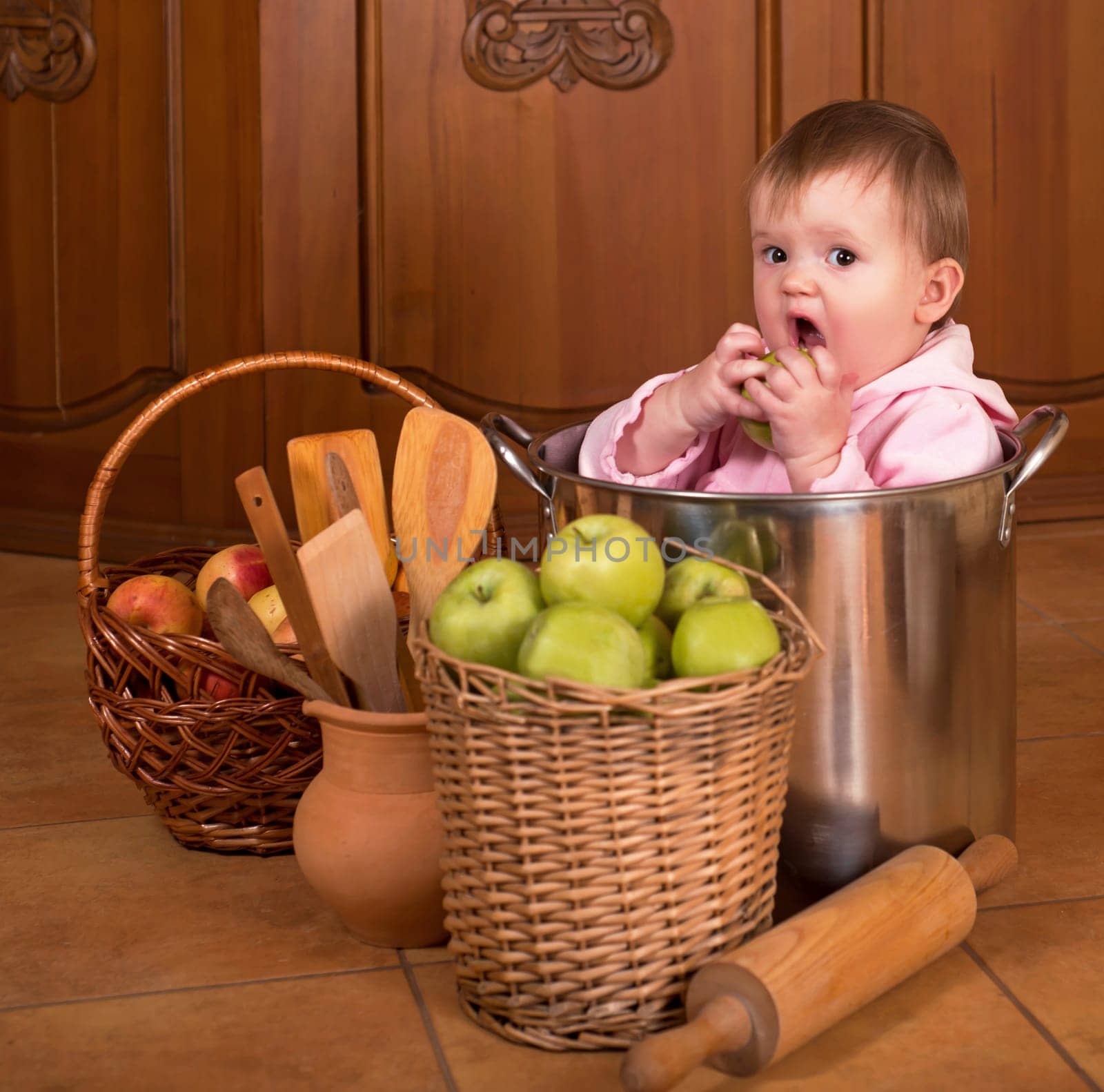 children pots and vegetables. Portrait of a smiling baby sitting inside a large cooking stock pot surrounded by vegetables and food by aprilphoto