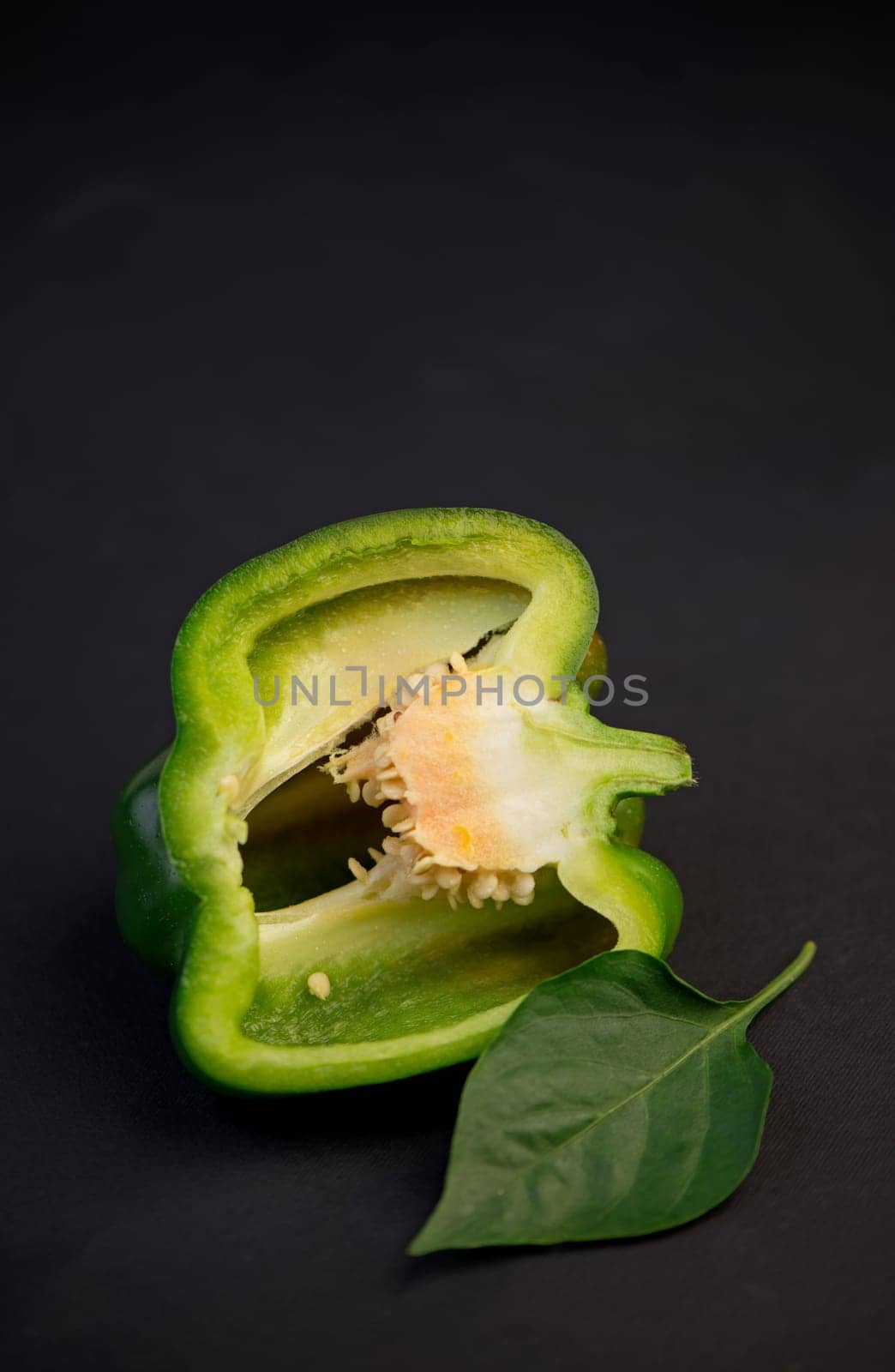 sweet pepper, green bell pepper on black background, full depth of field by aprilphoto