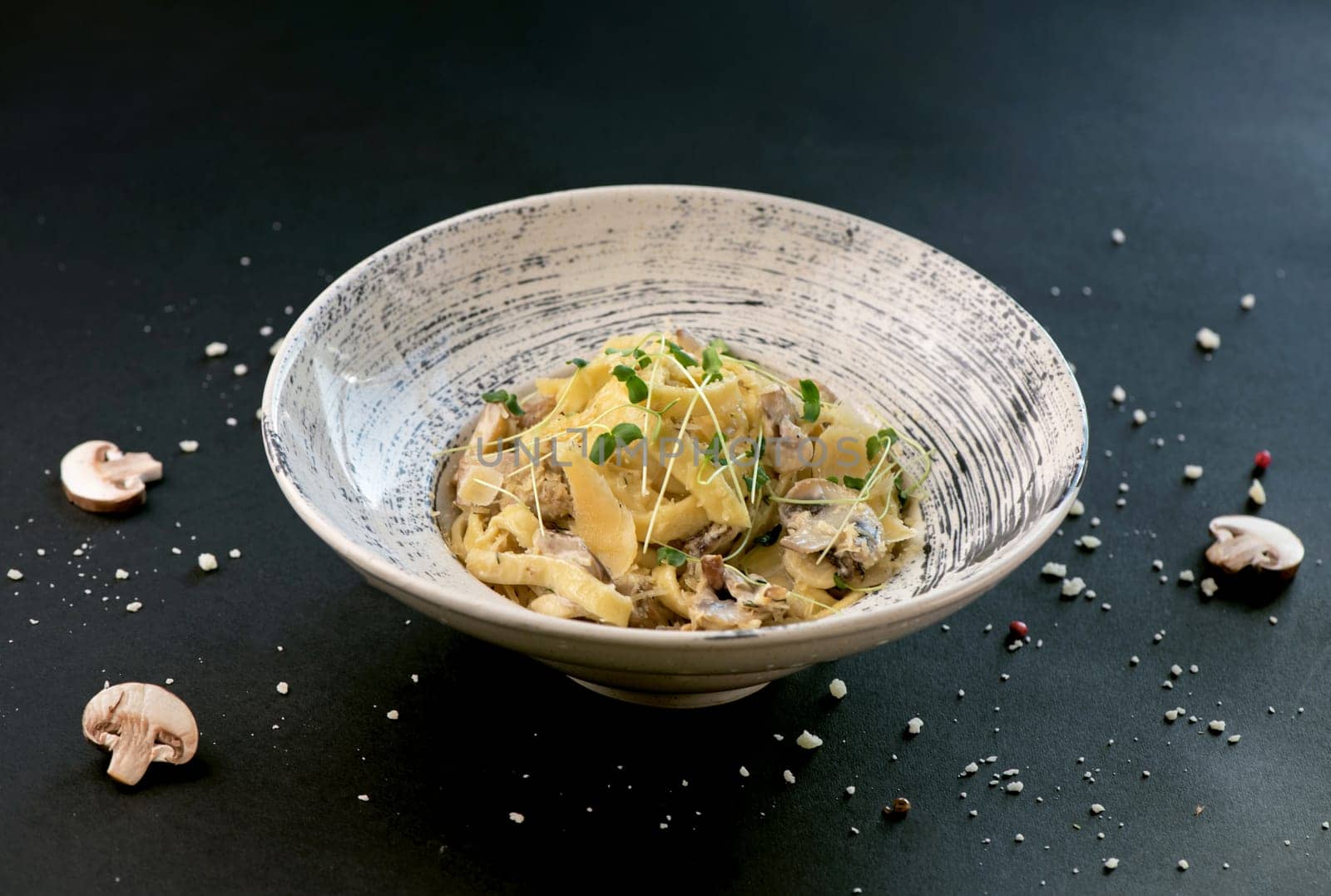 Mushrooms Spaghetti Pasta and cream sauce on a rustic background, top view. Homemade Italian pasta with champignons by aprilphoto