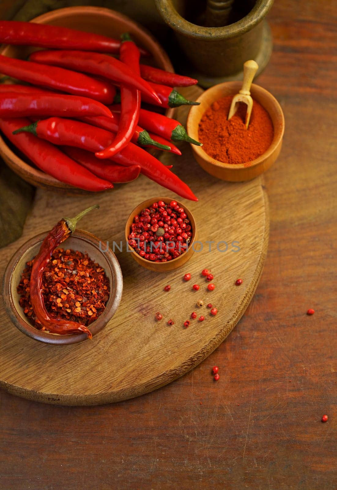 on old wooden table red hot chili peppers by aprilphoto