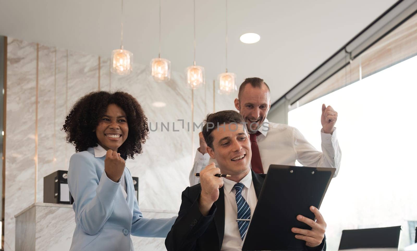 portrait of businesspeople team sitting in conference together in an office with intimate and excited the success on paperwork. Idea for a good relationship of teamwork in business.