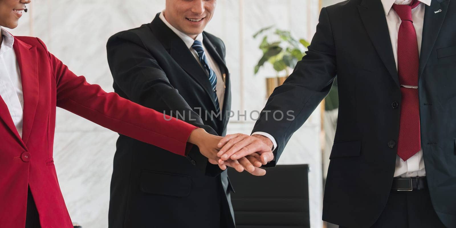businessman joining hand unity , business team touching hands together after complete a deal in meeting. unity teamwork partnership corporate concept..