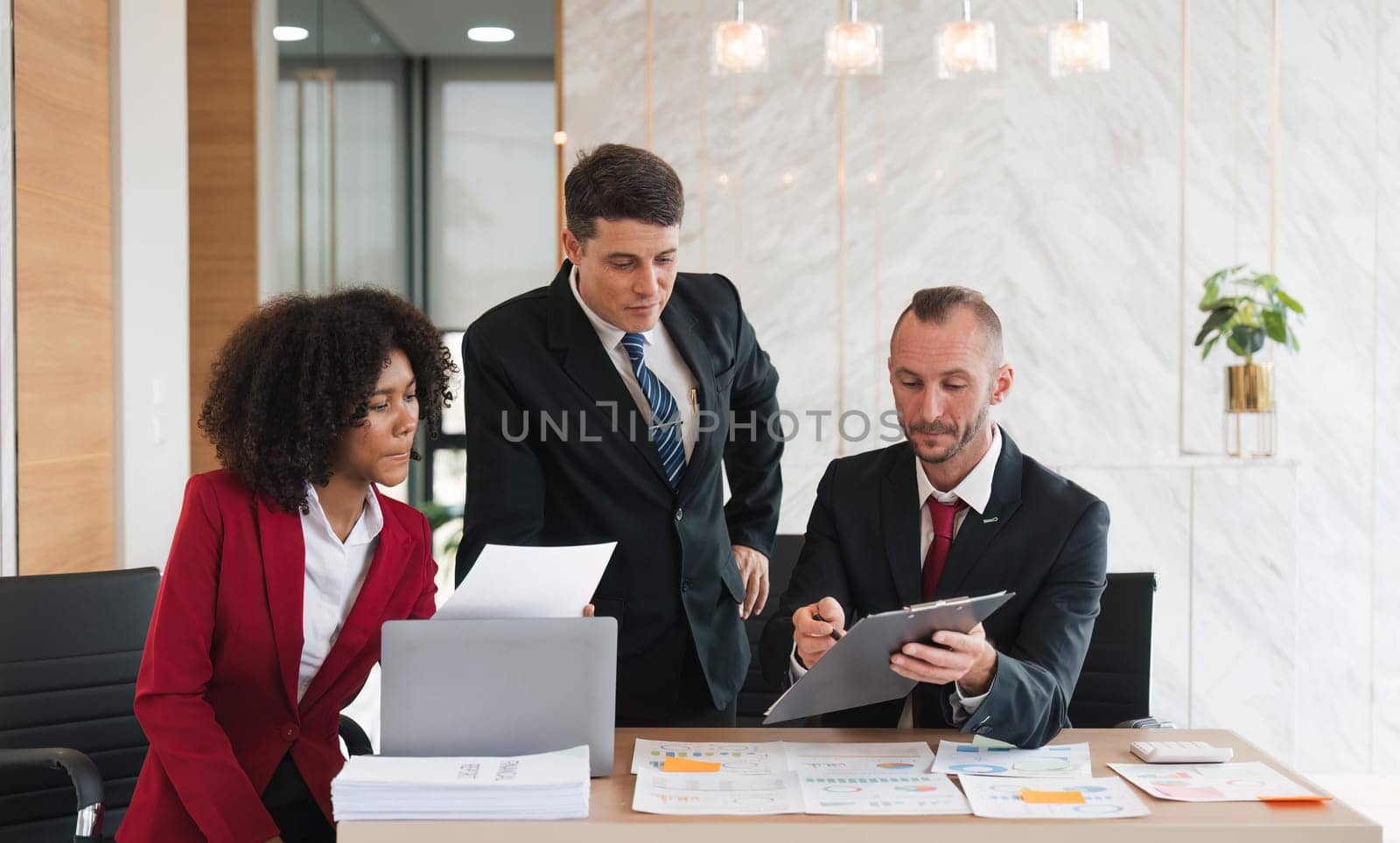 Diverse business team discussing project at corporate briefing in boardroom. colleagues meeting for brainstorming, sharing ideas, together. Teamwork concept.