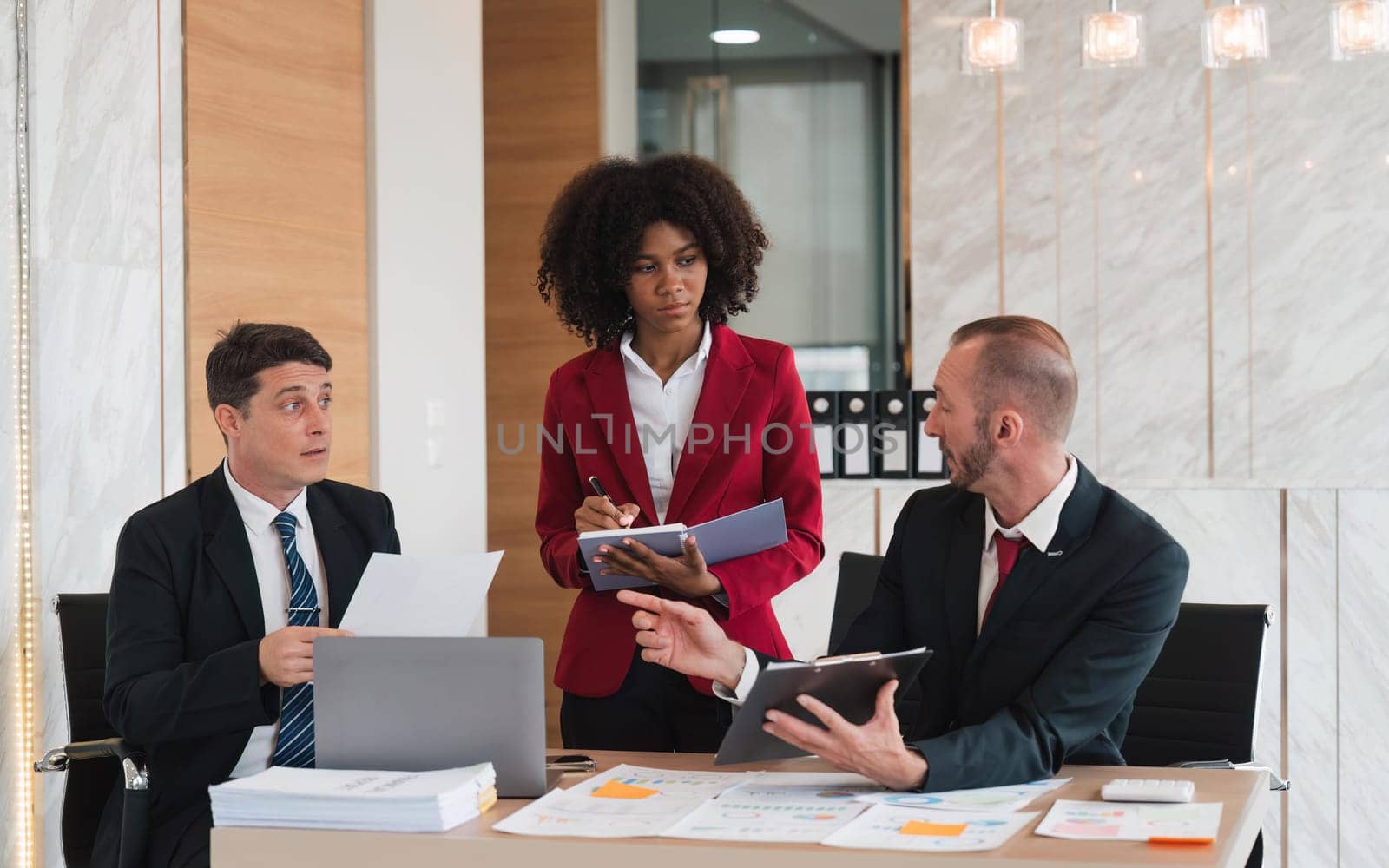 Diverse business team discussing project at corporate briefing in boardroom. colleagues meeting for brainstorming, sharing ideas, together. Teamwork concept.