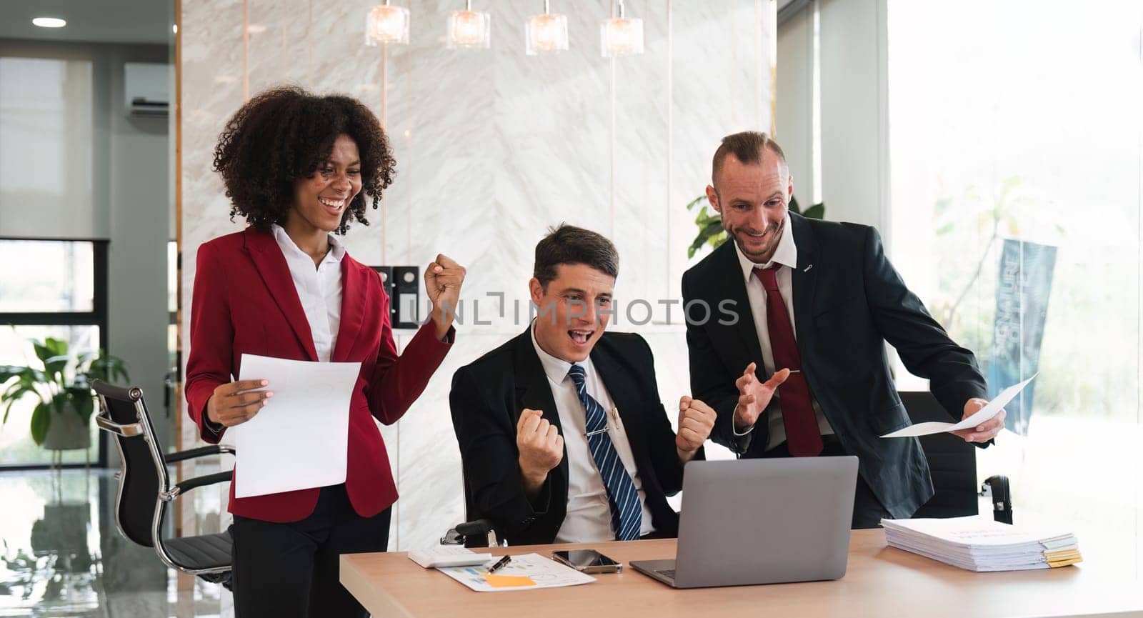 portrait of businesspeople team sitting in conference together in an office with intimate and excited the success on laptop. Idea for a good relationship of teamwork in business.