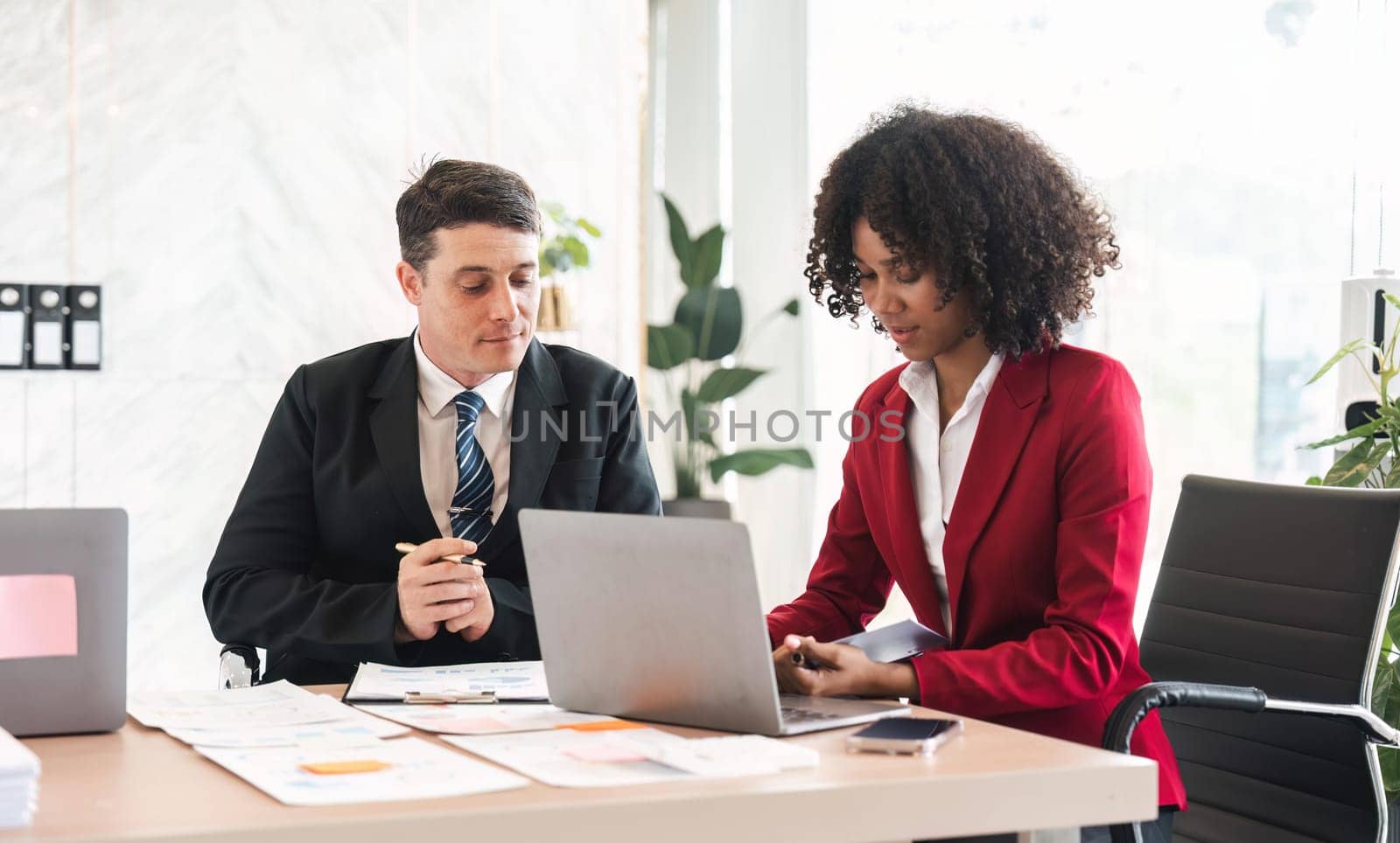 Diverse business team discussing project at corporate briefing in boardroom. colleagues meeting for brainstorming, sharing ideas, together. Teamwork concept.