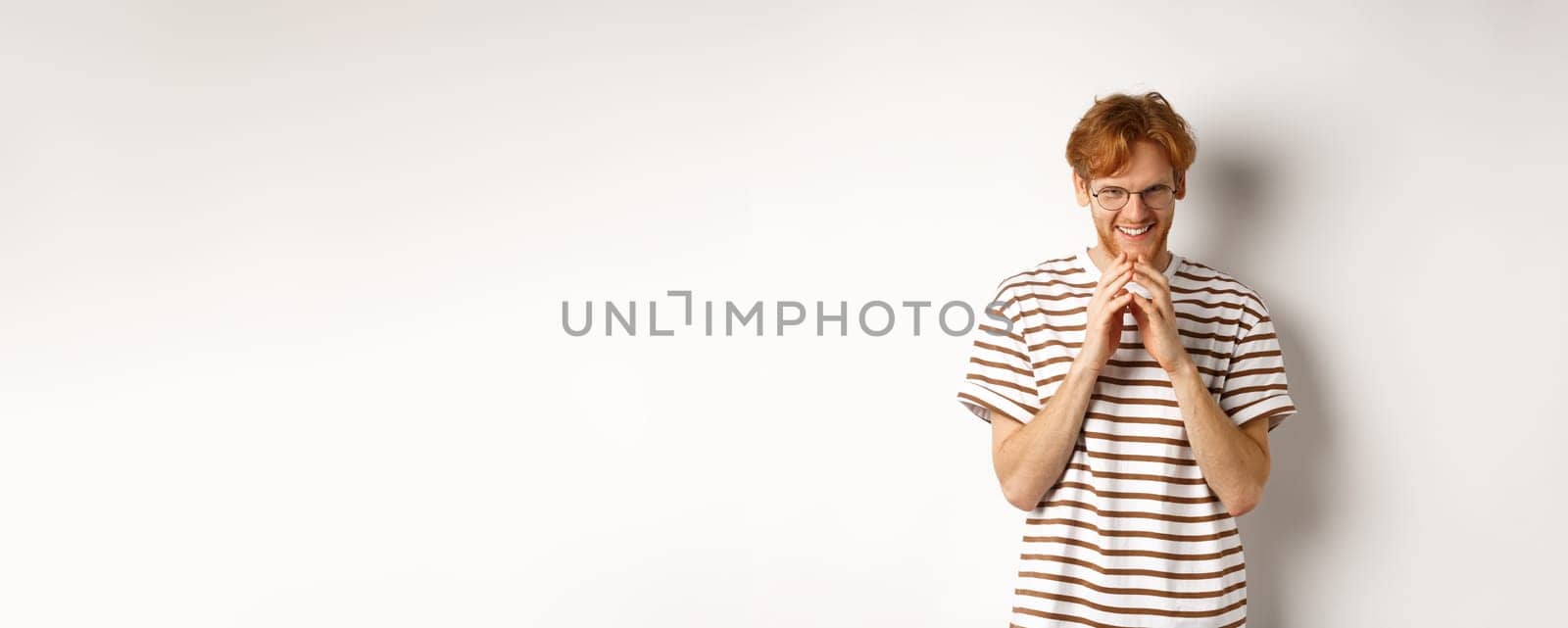 Portrait of redhead man looking like evil genius, steeple fingers and chuckling devious, scheming some plan, standing over white background by Benzoix