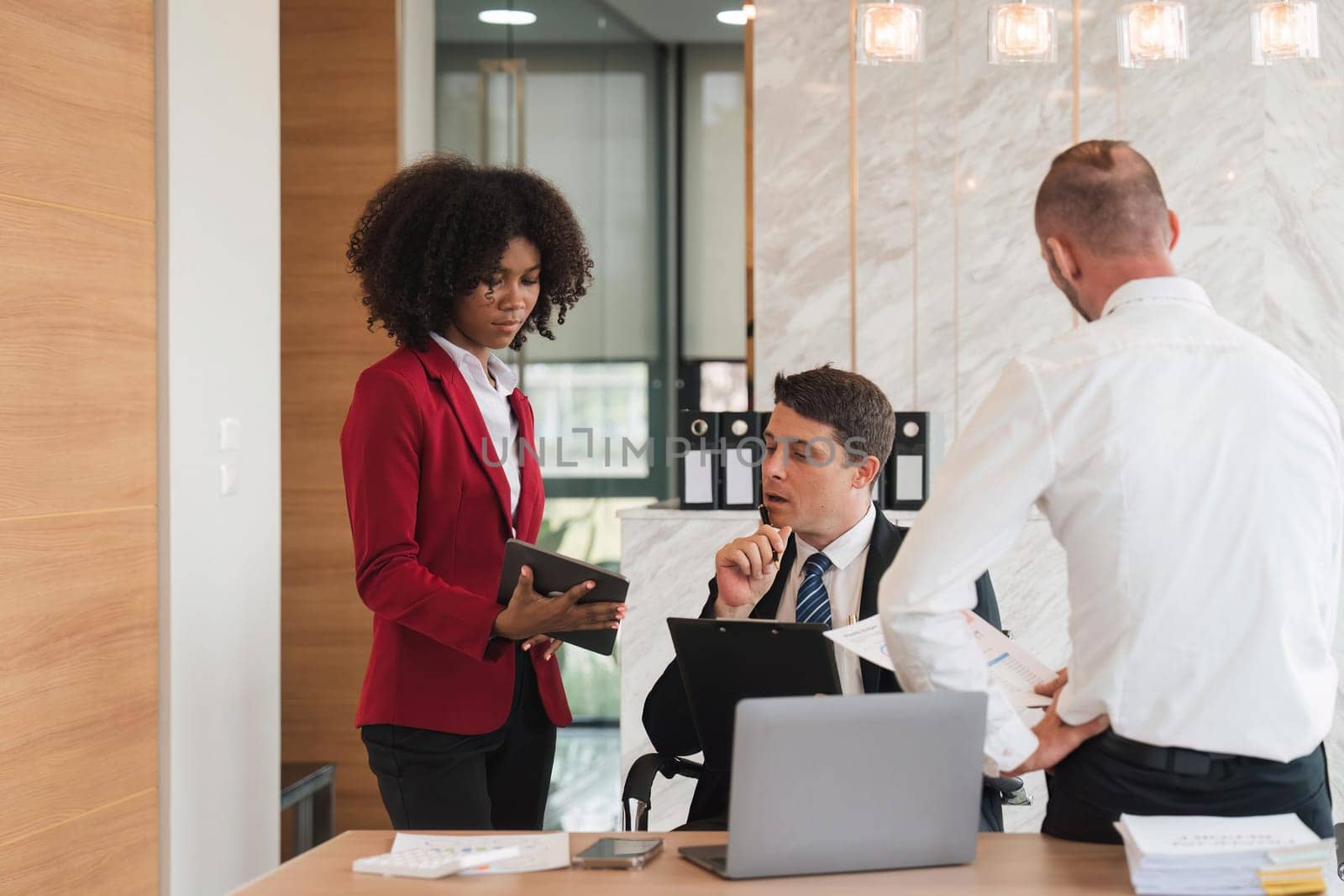 Diverse business team discussing project at corporate briefing in boardroom. colleagues meeting for brainstorming, sharing ideas, together. Teamwork concept.