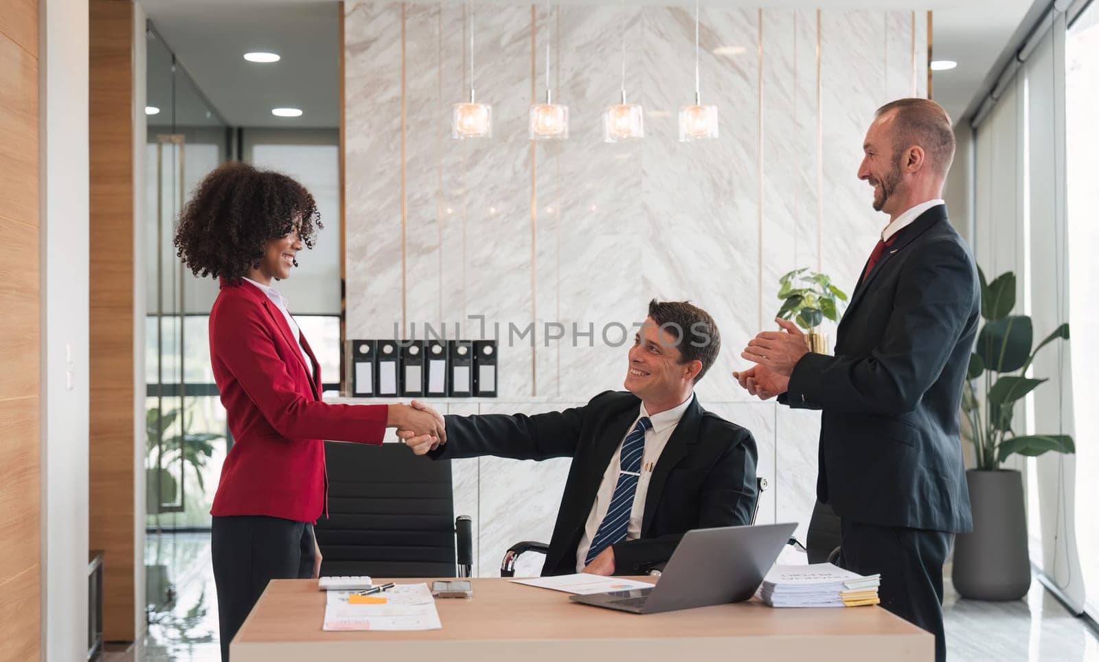 business holding hands, businessmen are agreeing on business together and shaking hands after a successful negotiation. Handshaking is a or congratulation.