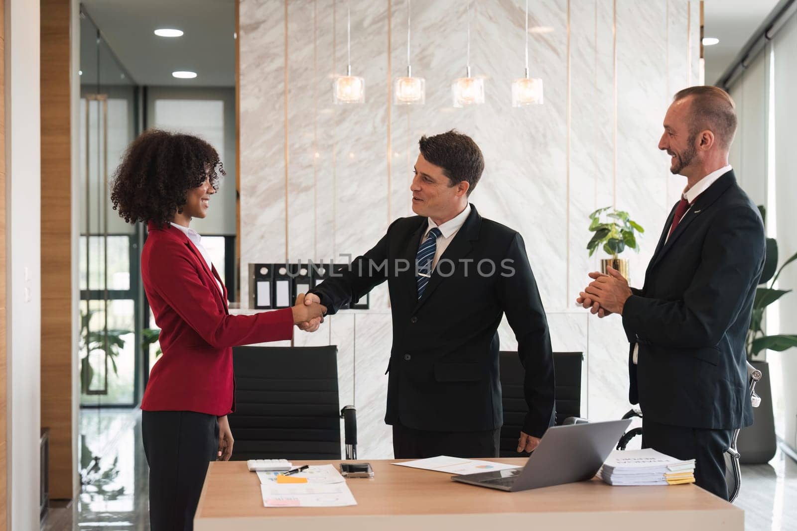 business holding hands, businessmen are agreeing on business together and shaking hands after a successful negotiation. Handshaking is a or congratulation.