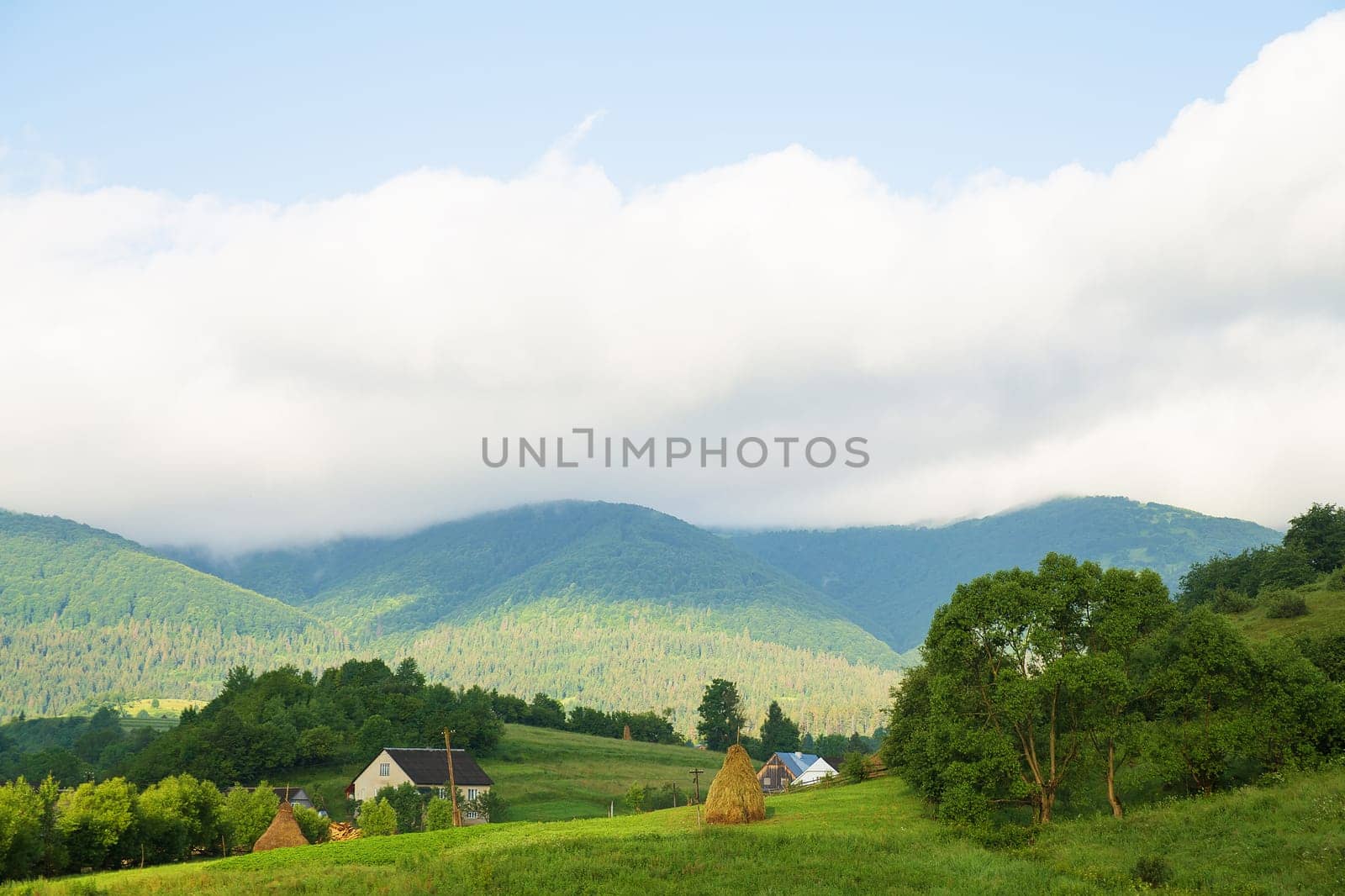 Haystack summer in the beautiful village Ukrainian Carpathians